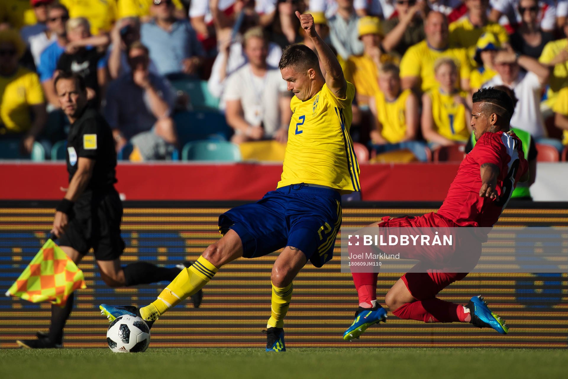 Mikael Lustig of Sweden and Miguel Trauco of Peru