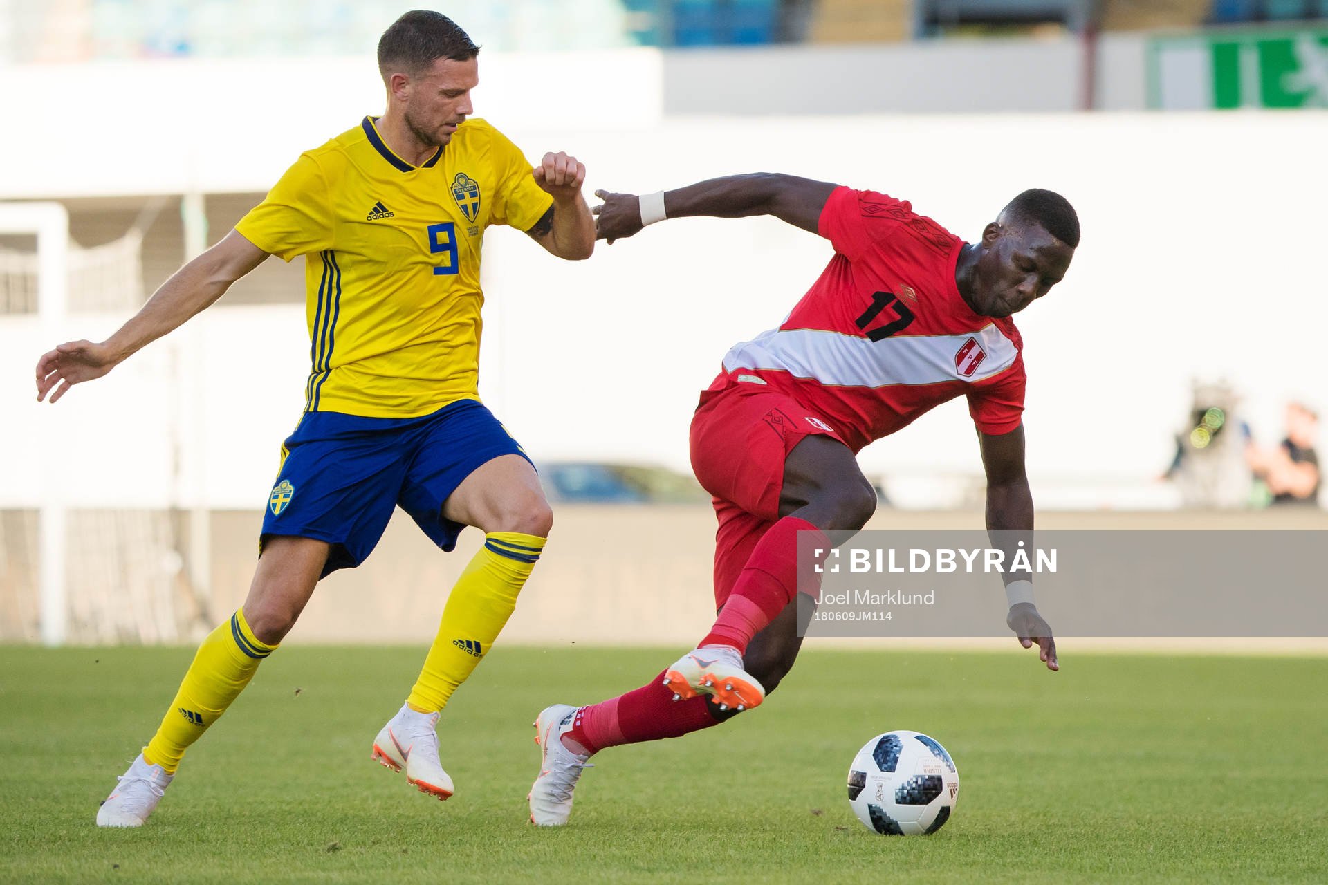 Marcus Berg of Sweden and Luis Advincula of Peru