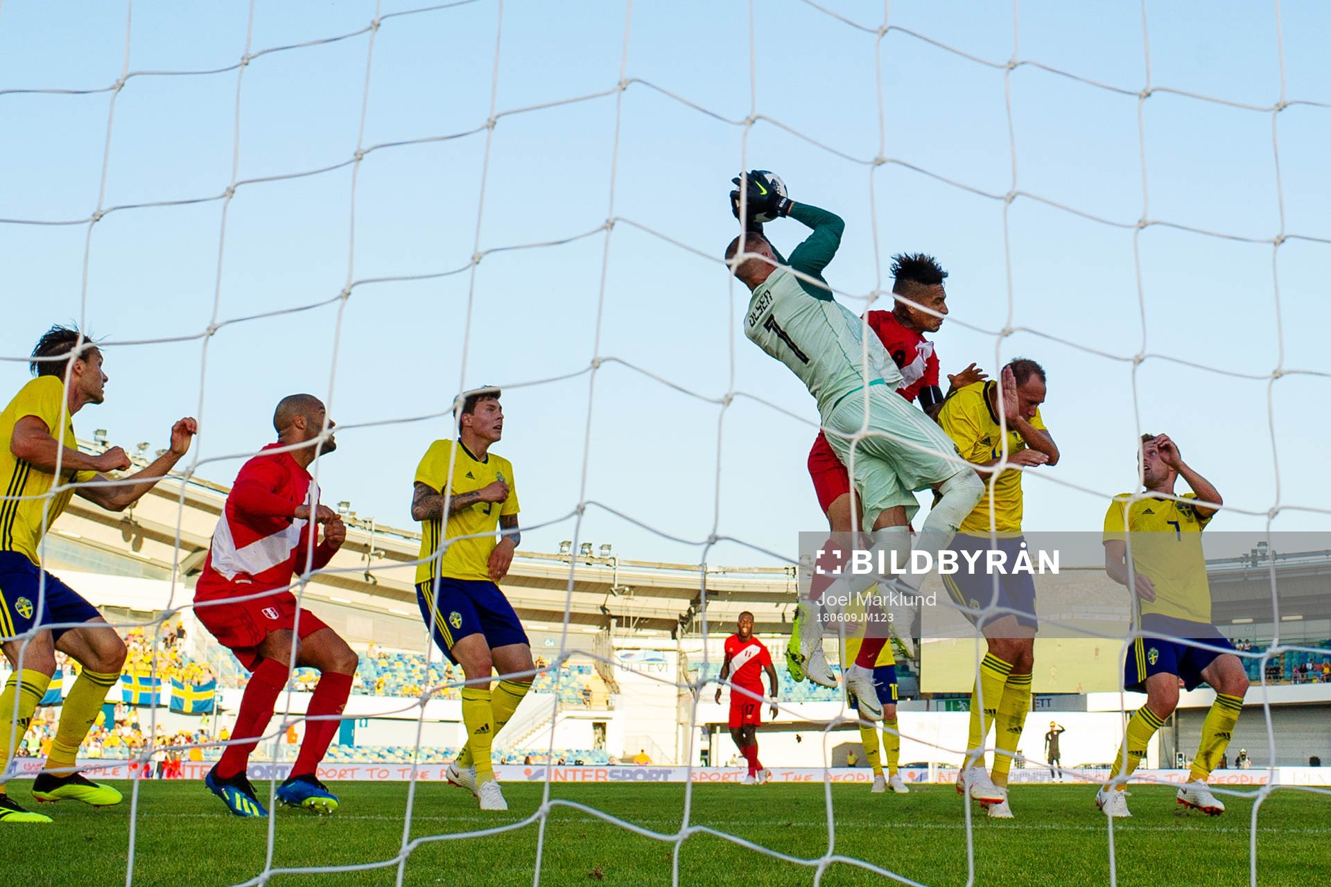 Goalkeeper Robin Olsen of Sweden collides with Paolo