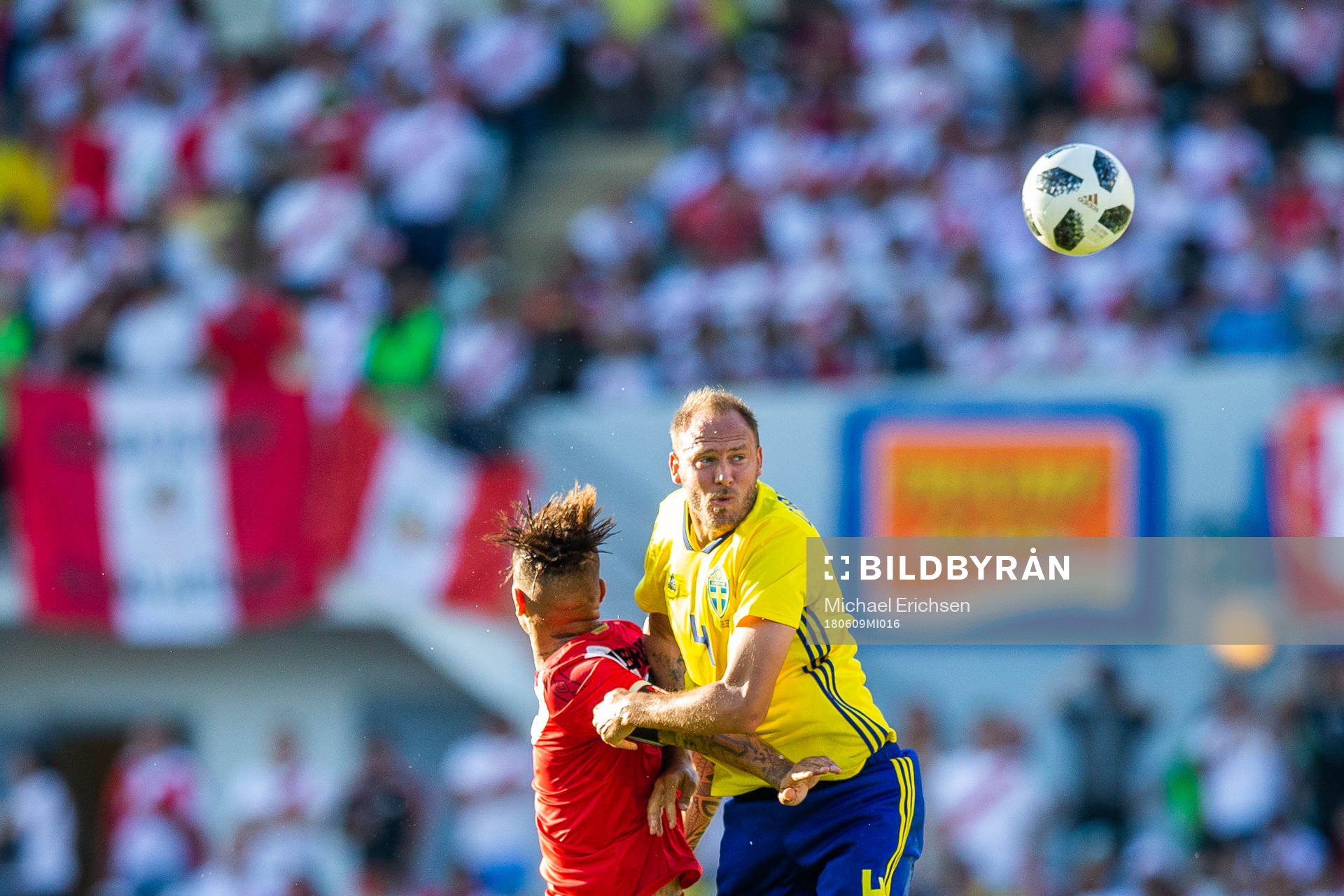Paolo Guerrero of Peru competes for the ball with Andreas
