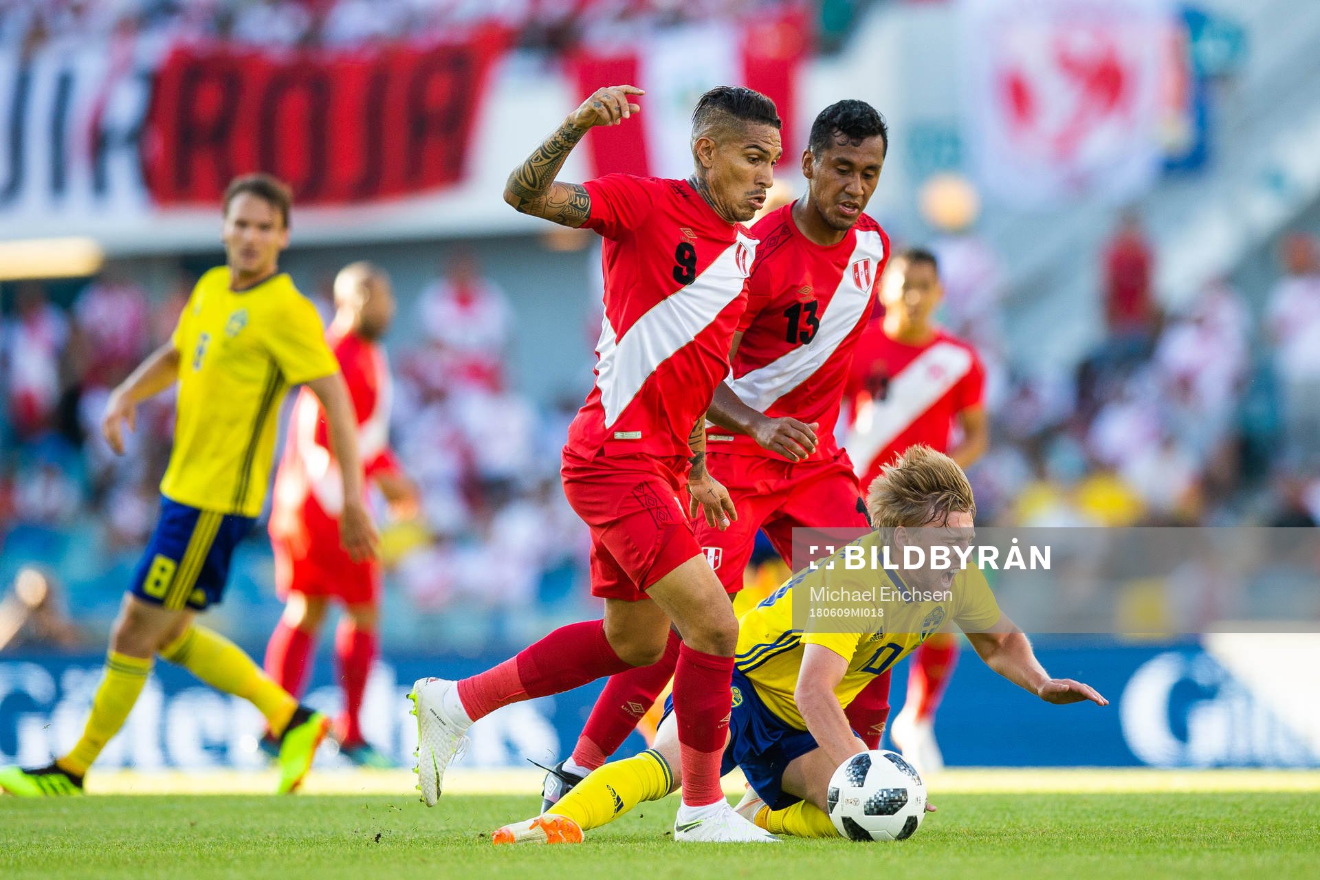 Paolo Guerrero and Renato Tapia of Peru competes for the