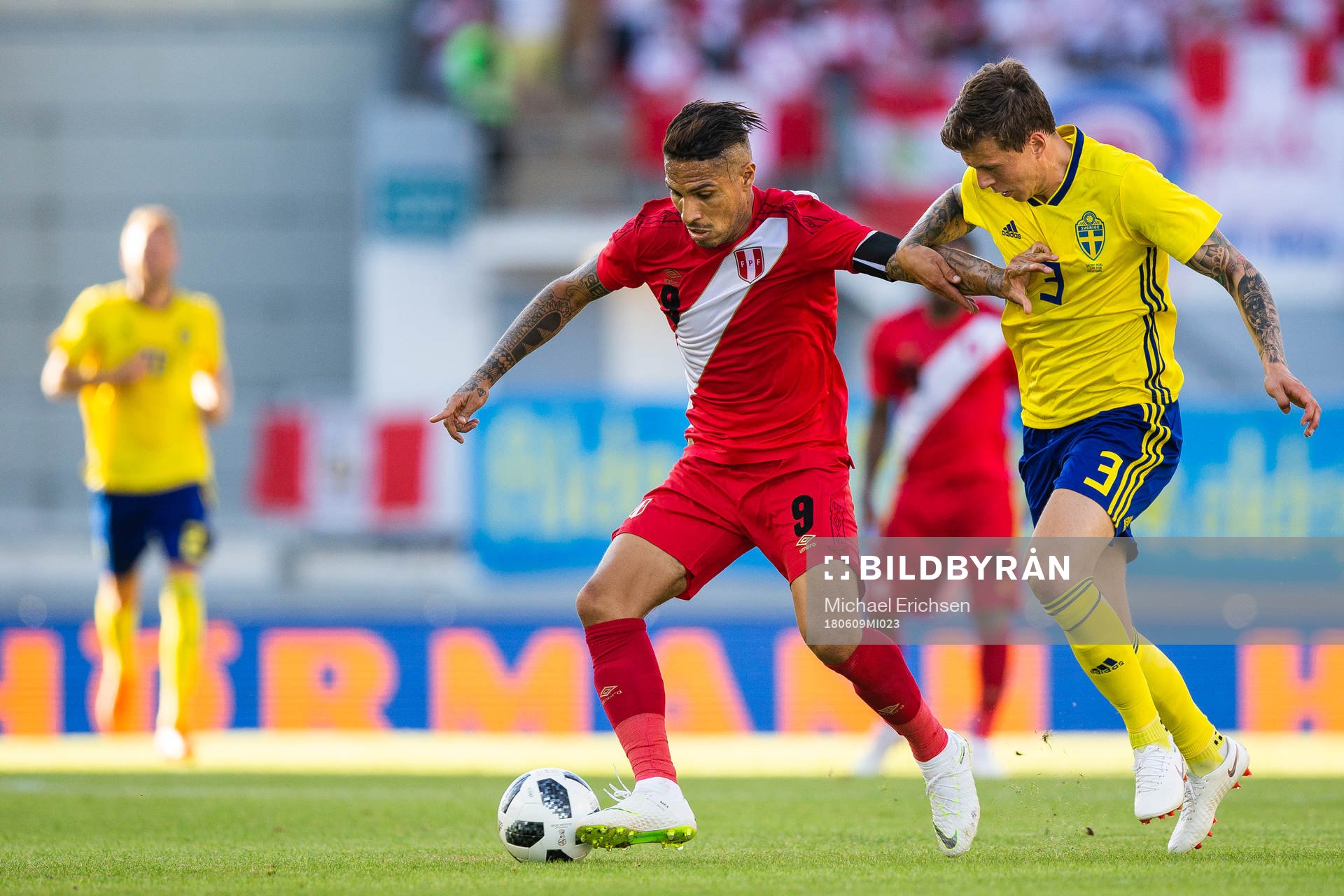 Paolo Guerrero of Peru competes for the ball with Victor