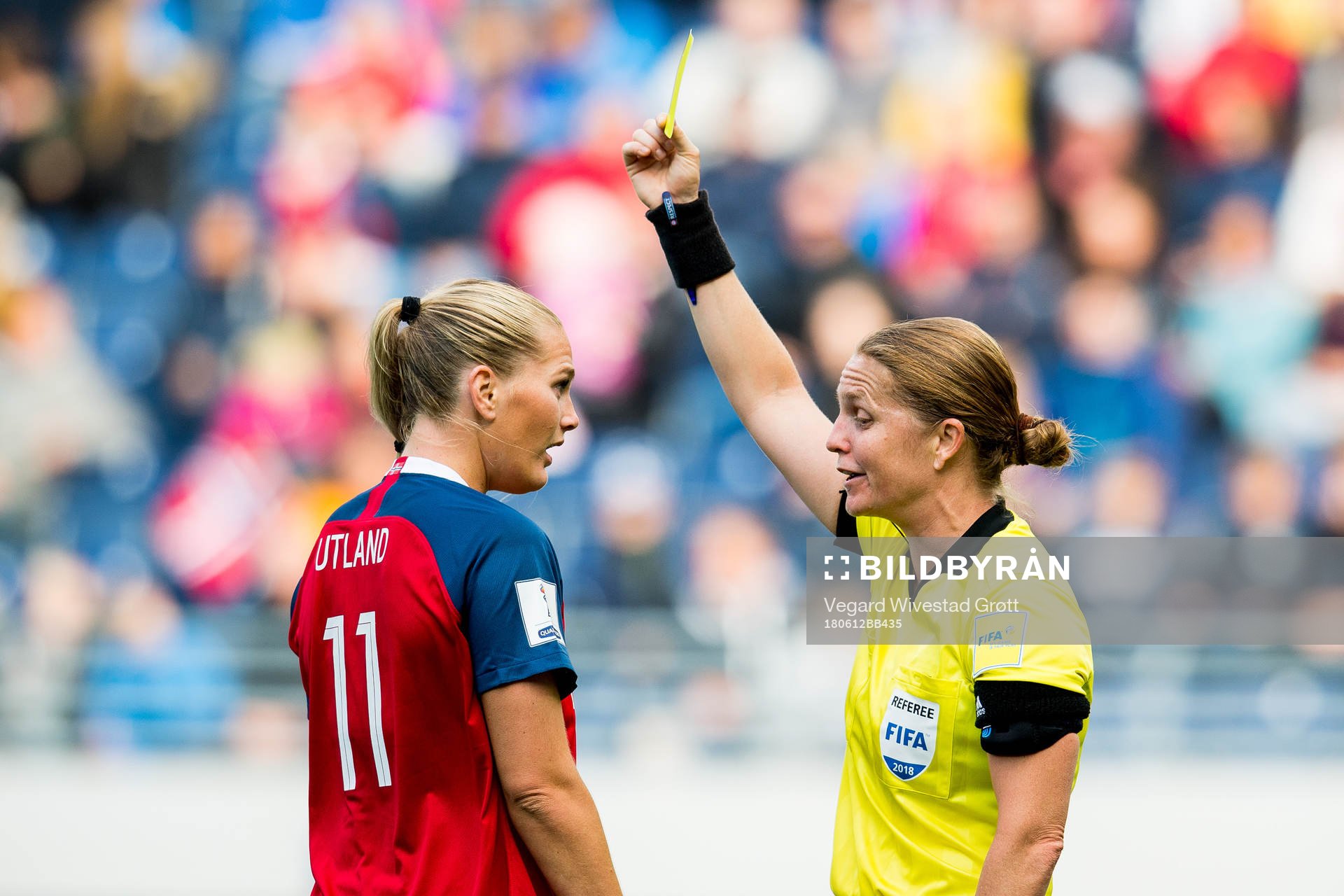 Lisa-Marie Karlseng Utland of Norway is given a yellow card
