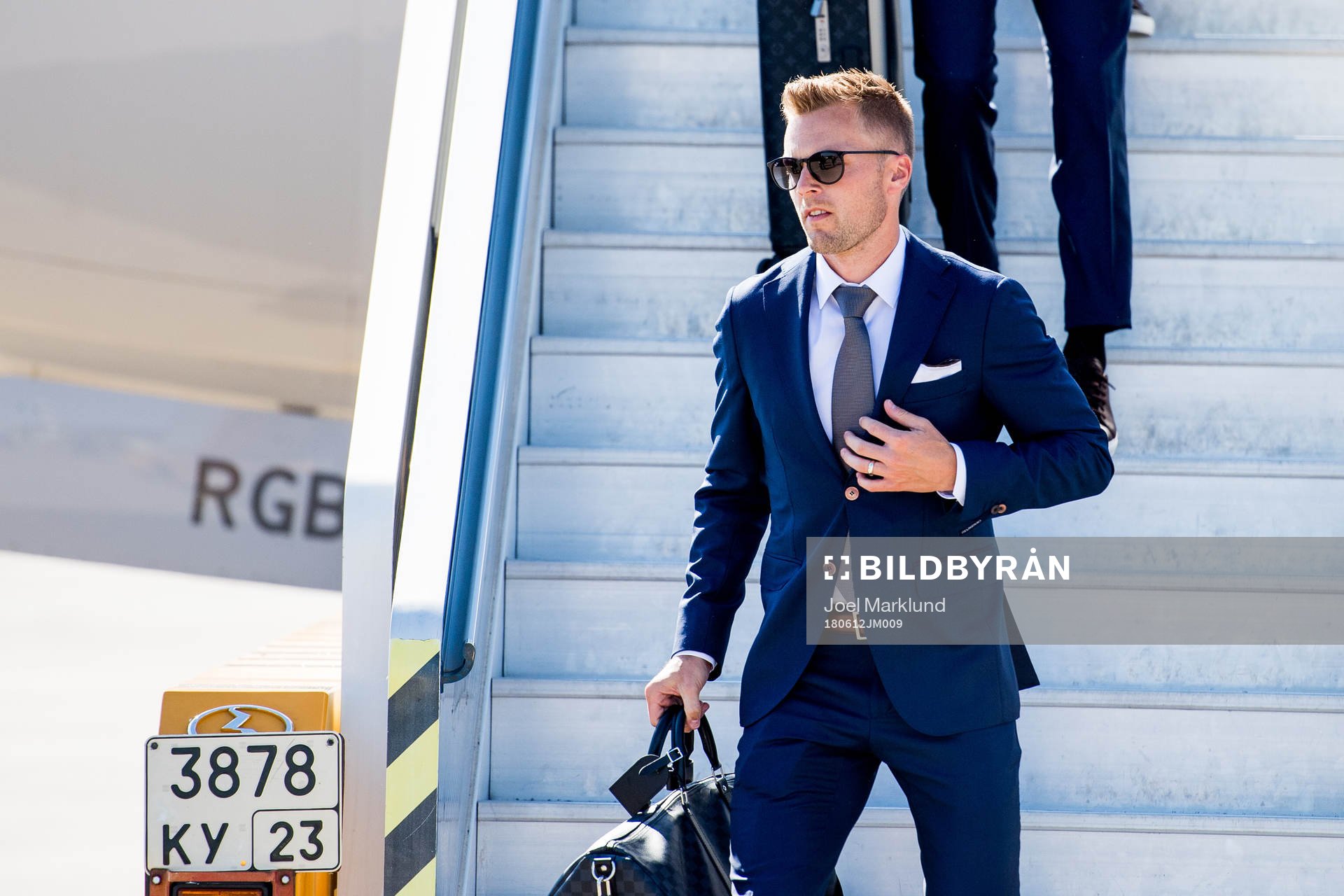 Sebastian Larsson of Sweden disembarks the plane when the