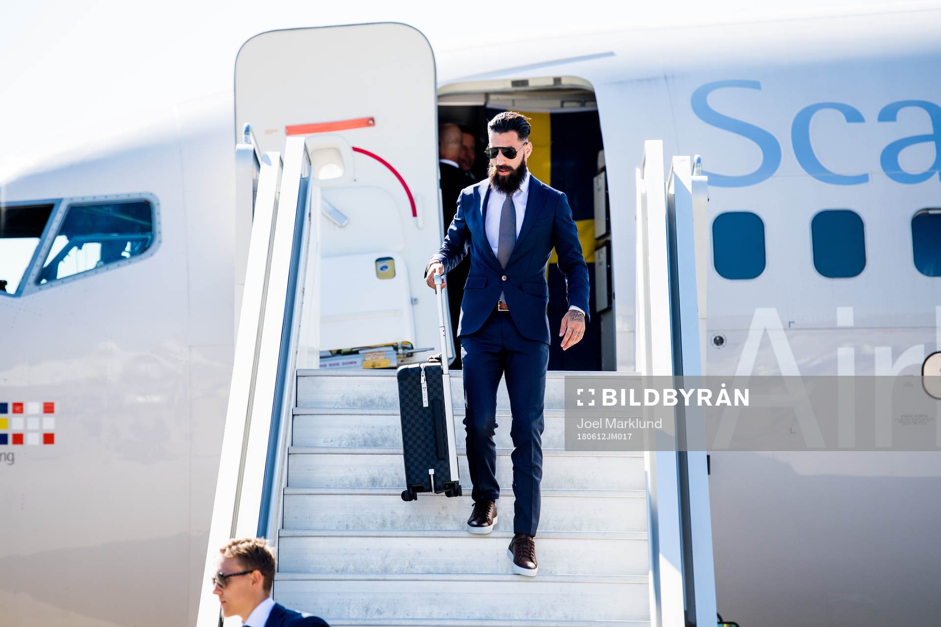 Jimmy Durmaz of Sweden disembarks the plane when the
