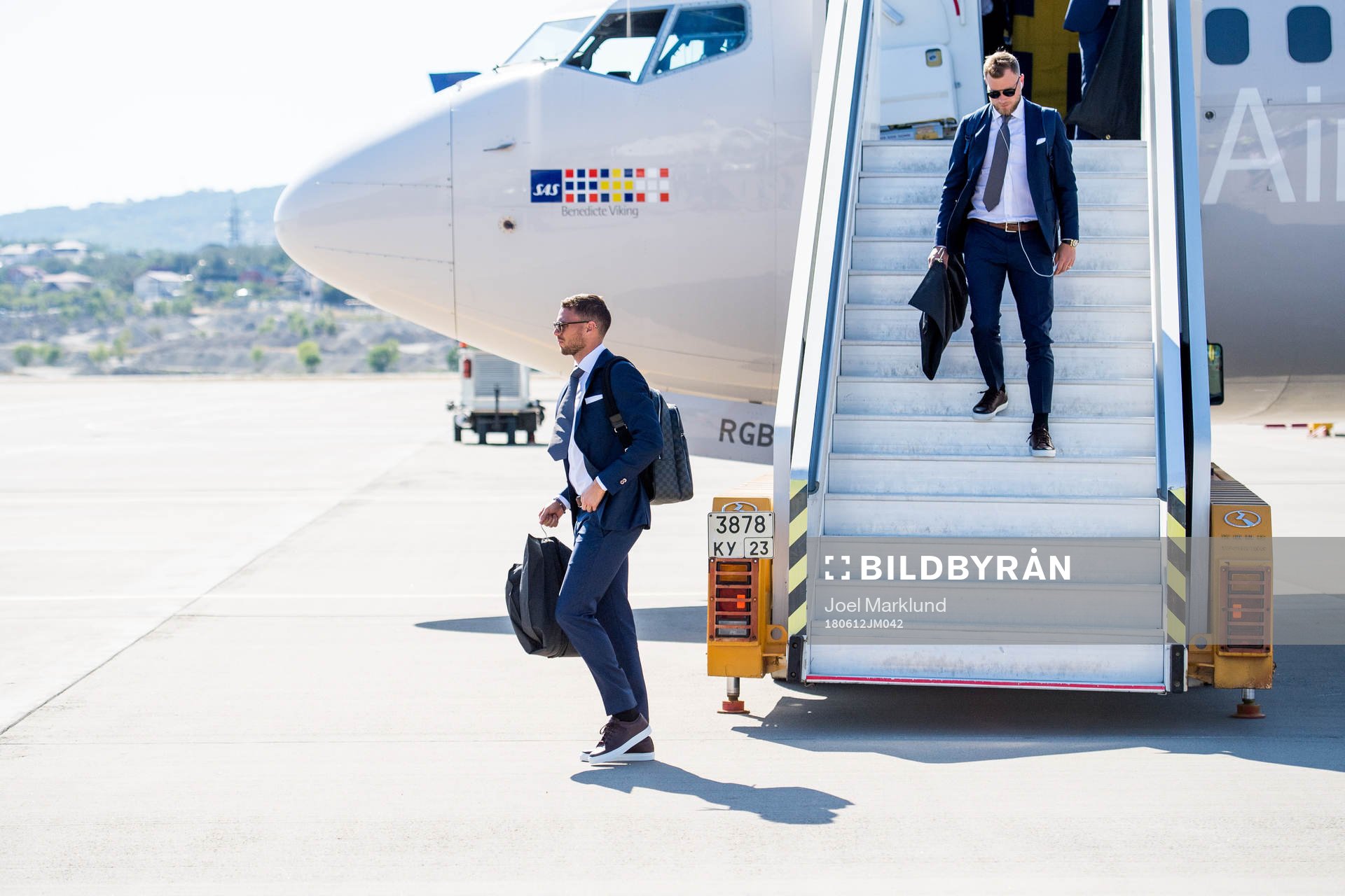 Marcus Berg and John Guidetti of Sweden disembark the plane
