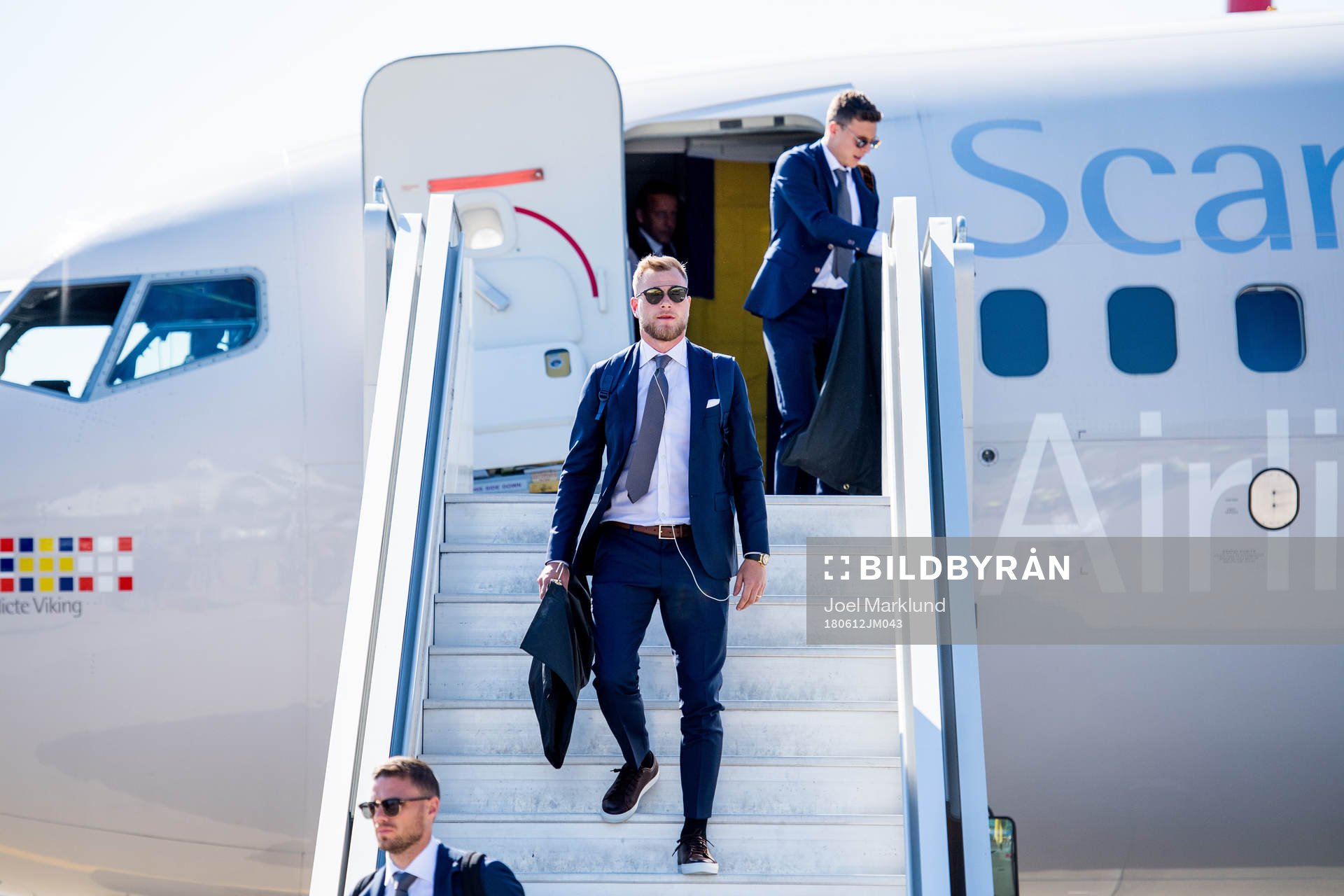 Marcus Berg and John Guidetti of Sweden disembark the plane