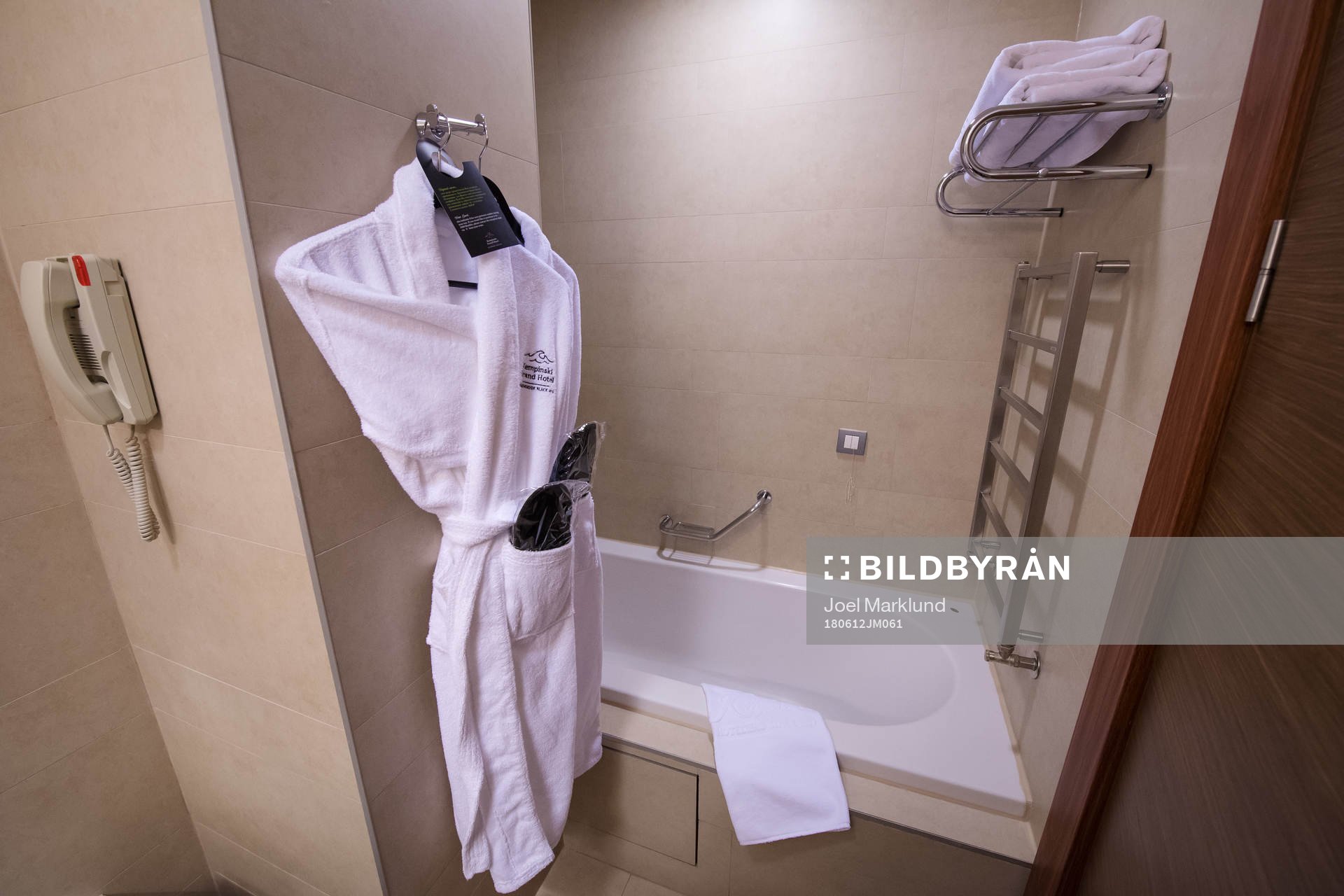 A bathrobe hanging inside a bathroom