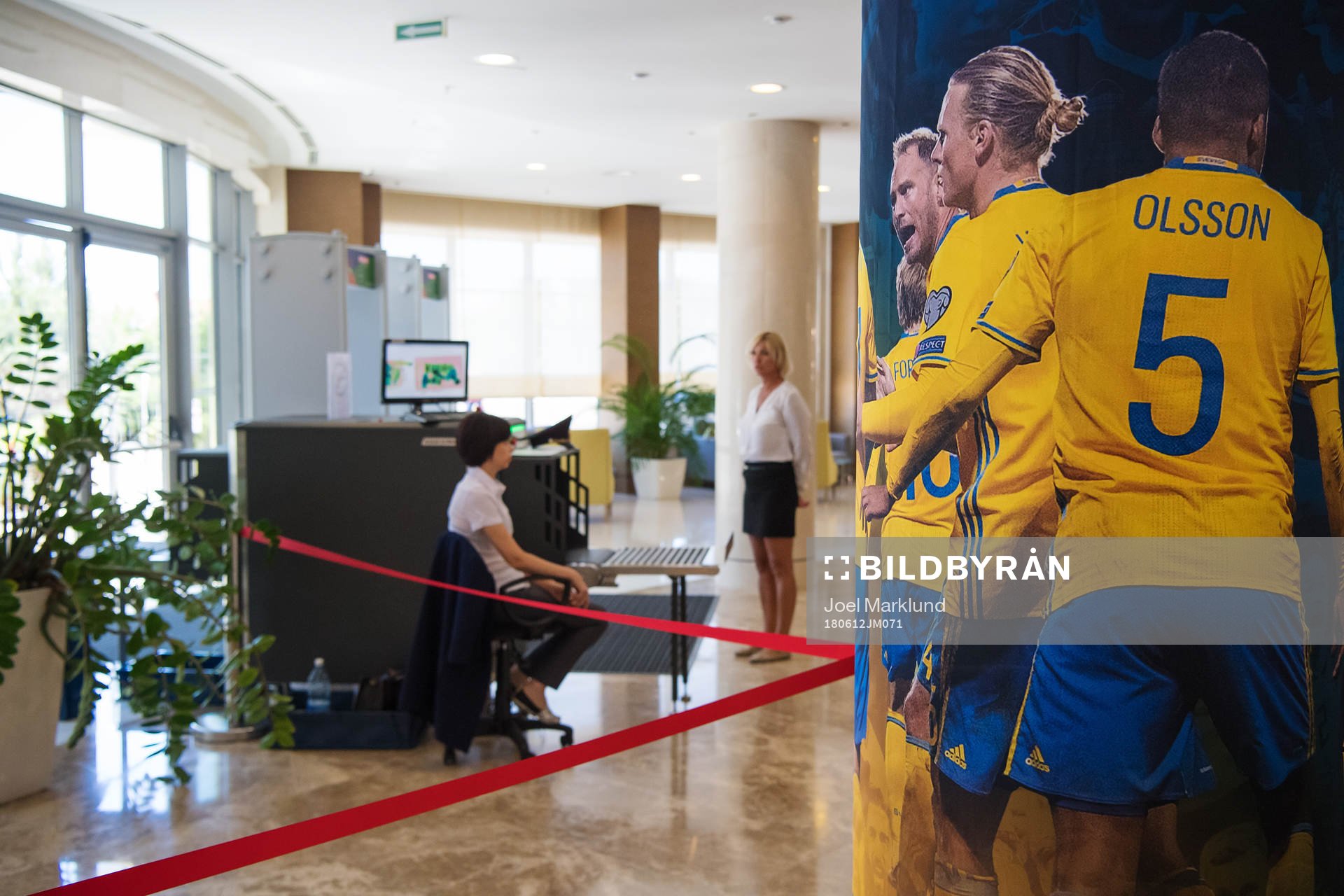 Security screening devices in front of images of Swedish