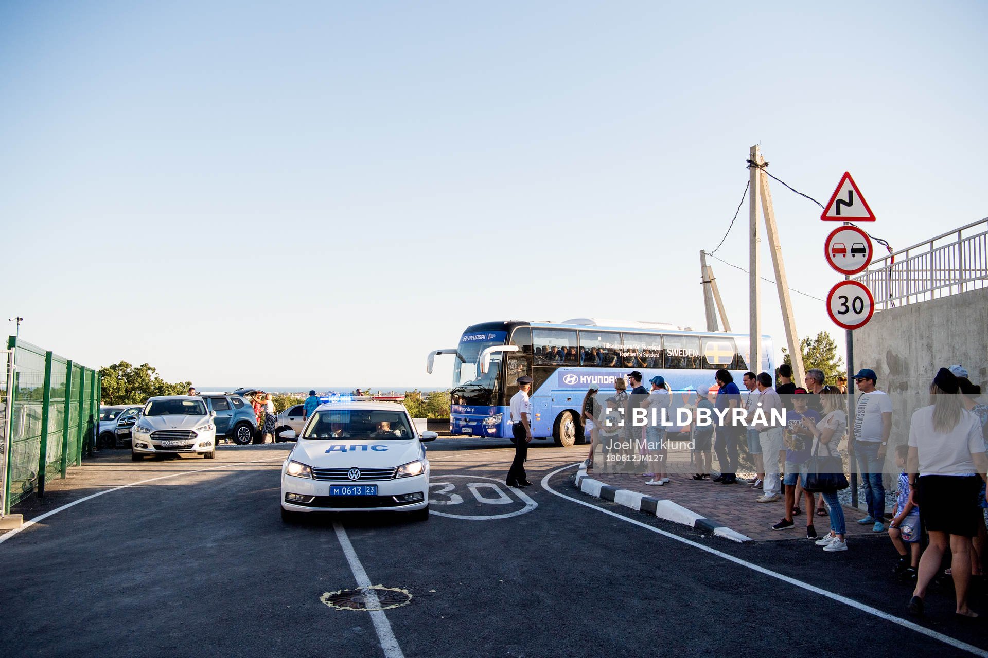The Swedish team bus is escorted by police to the practice