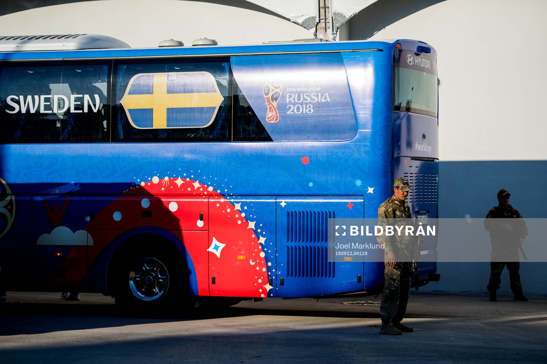 Heavily armed military guards by the Swedish bus