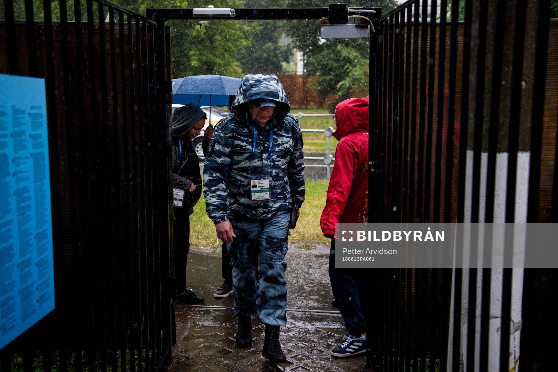 Russian security personnel is seen in the heavy rain prior