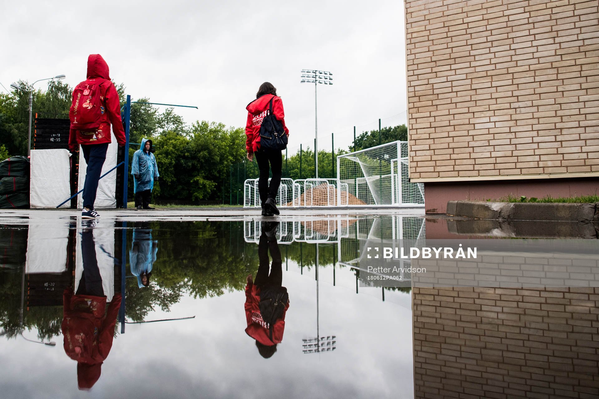 Volunteers is reflected in a puddle