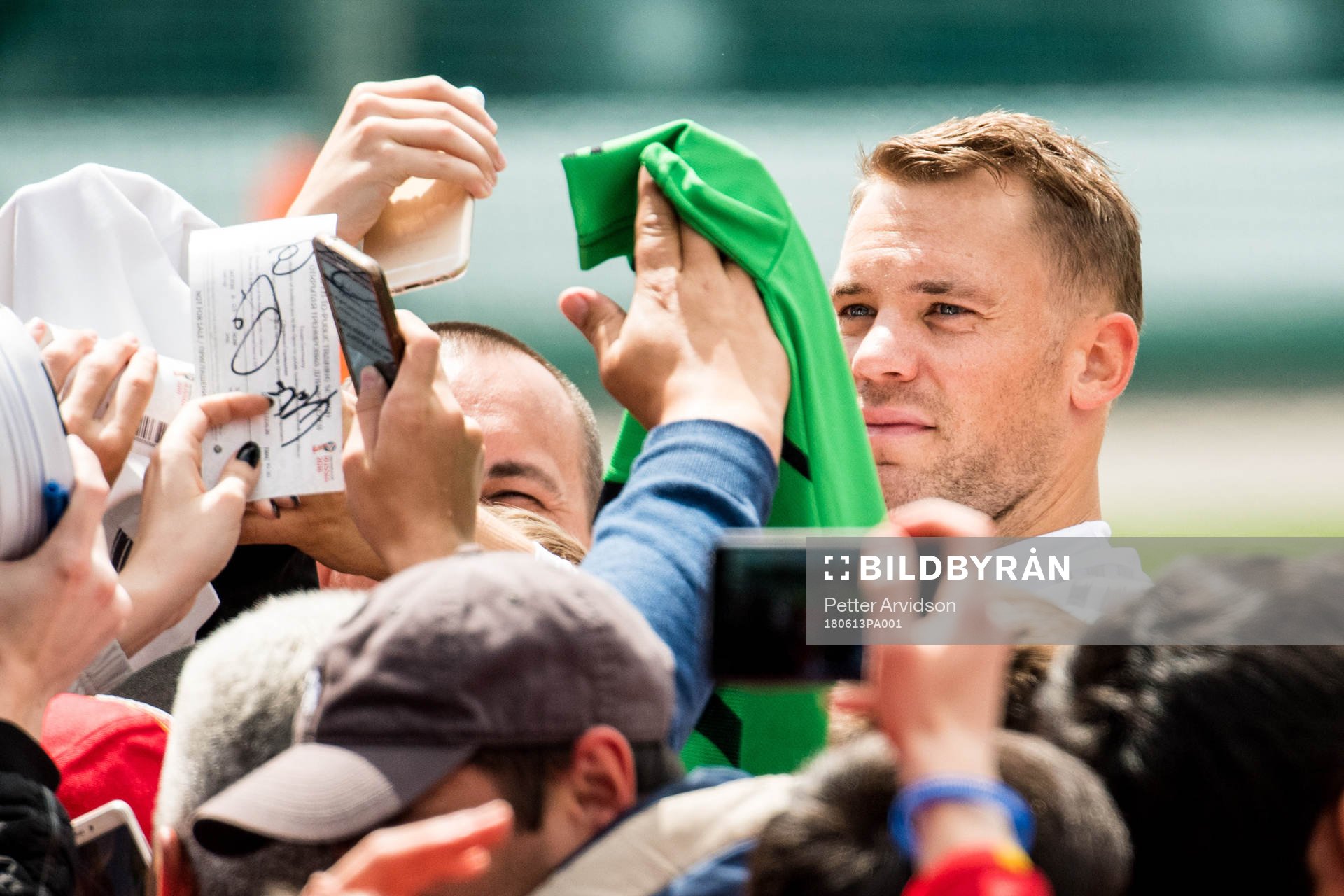 Goalkeeper Manuel Neuer of Germany signs autographs to fans