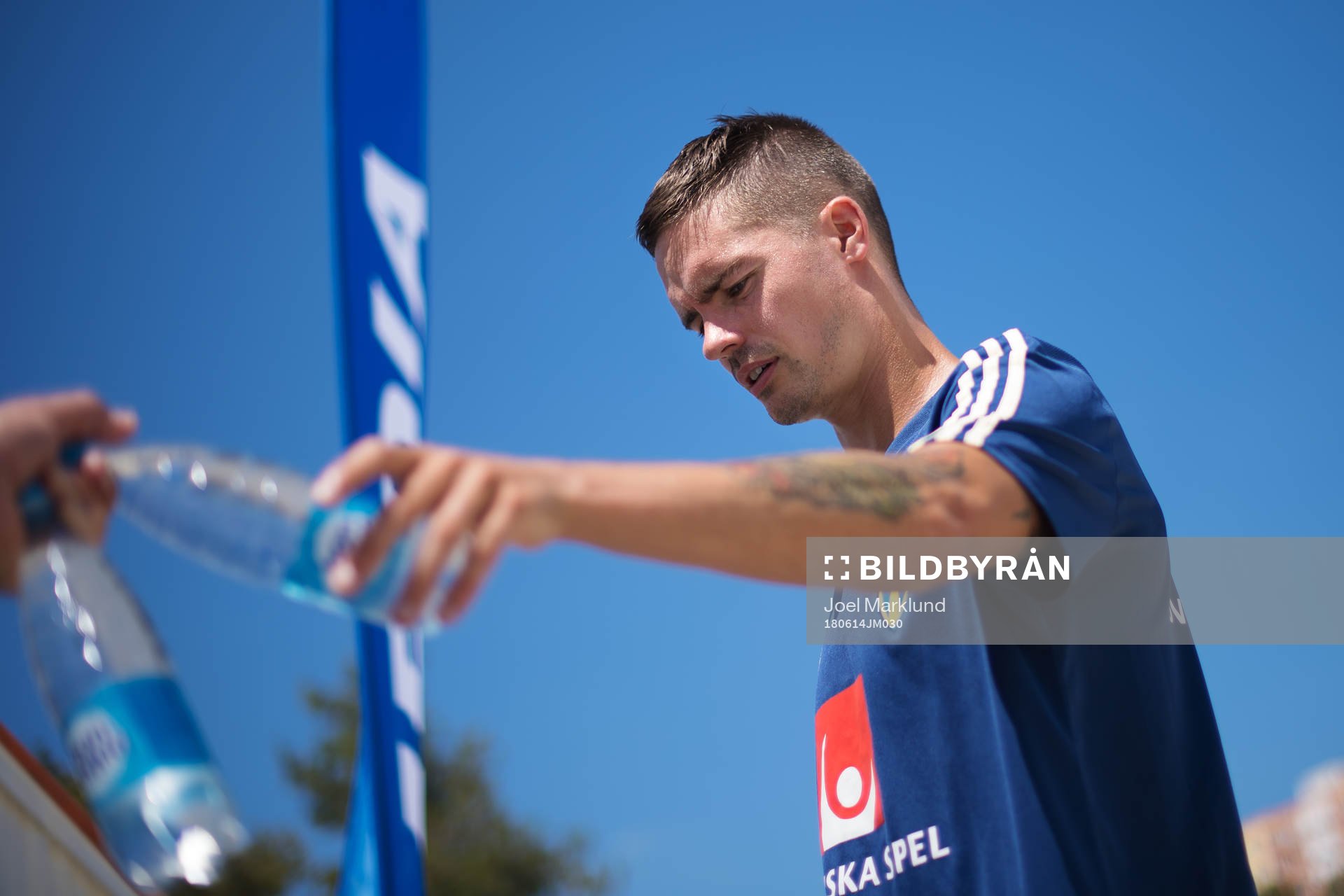 Mikael Lustig of the Swedish national football team reaches