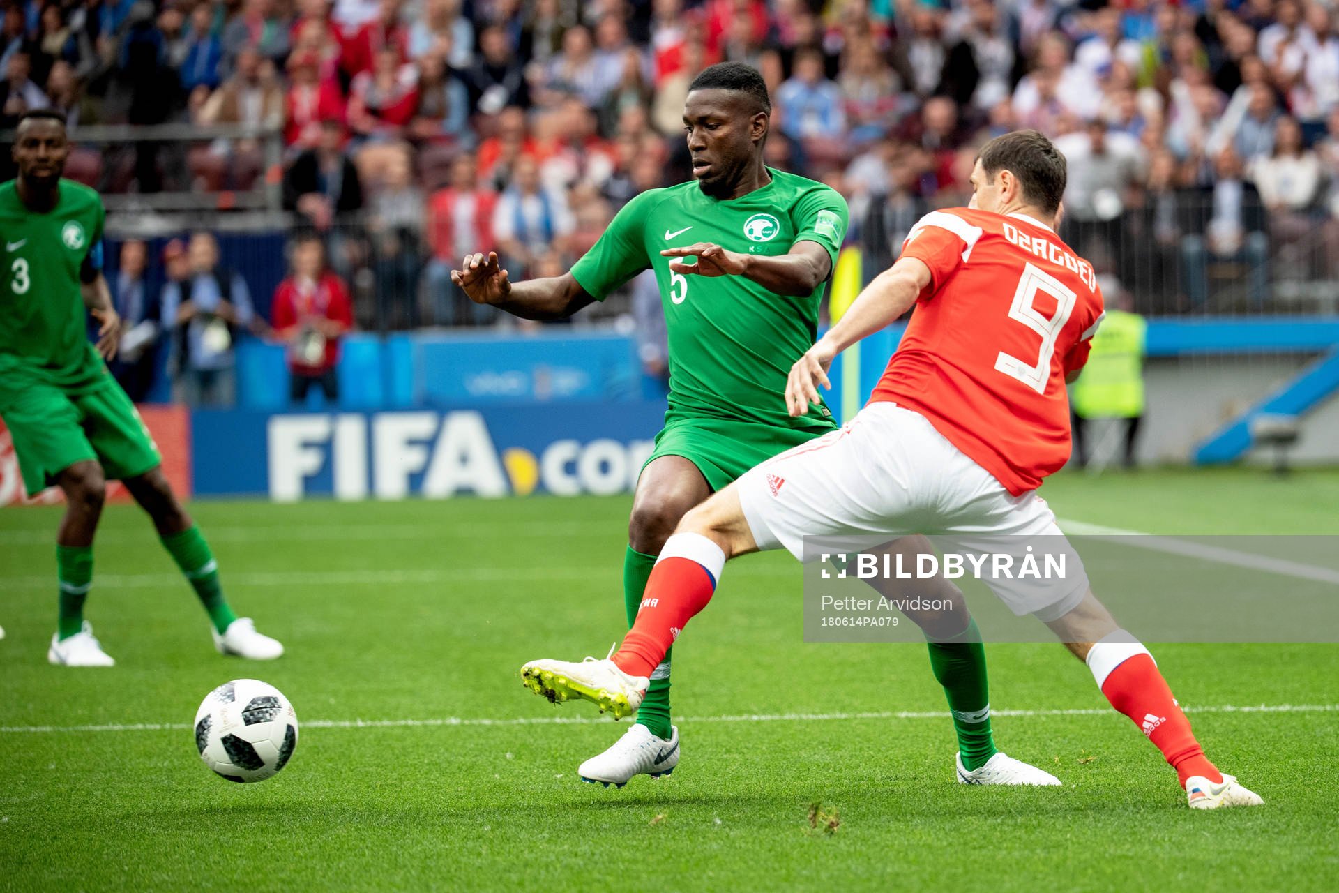 oOmar Othman of Saudiarabia and Alan Dzagoev of Russia during the FIFA World Cup group stage match between Russia and Saudi Arabia on June 14, 2018 in Moscow.