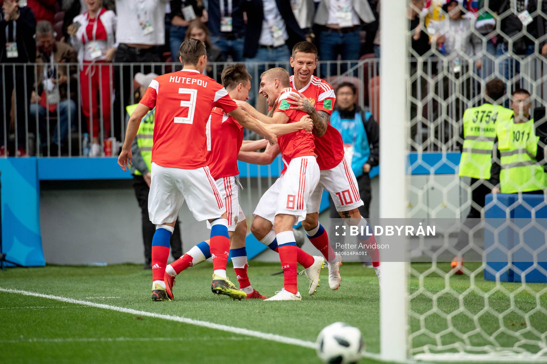 Iury Gazinsky of Russia celebrates with his teammates after scoring 1-0 during the FIFA World Cup group stage match between Russia and Saudi Arabia on June 14, 2018 in Moscow.