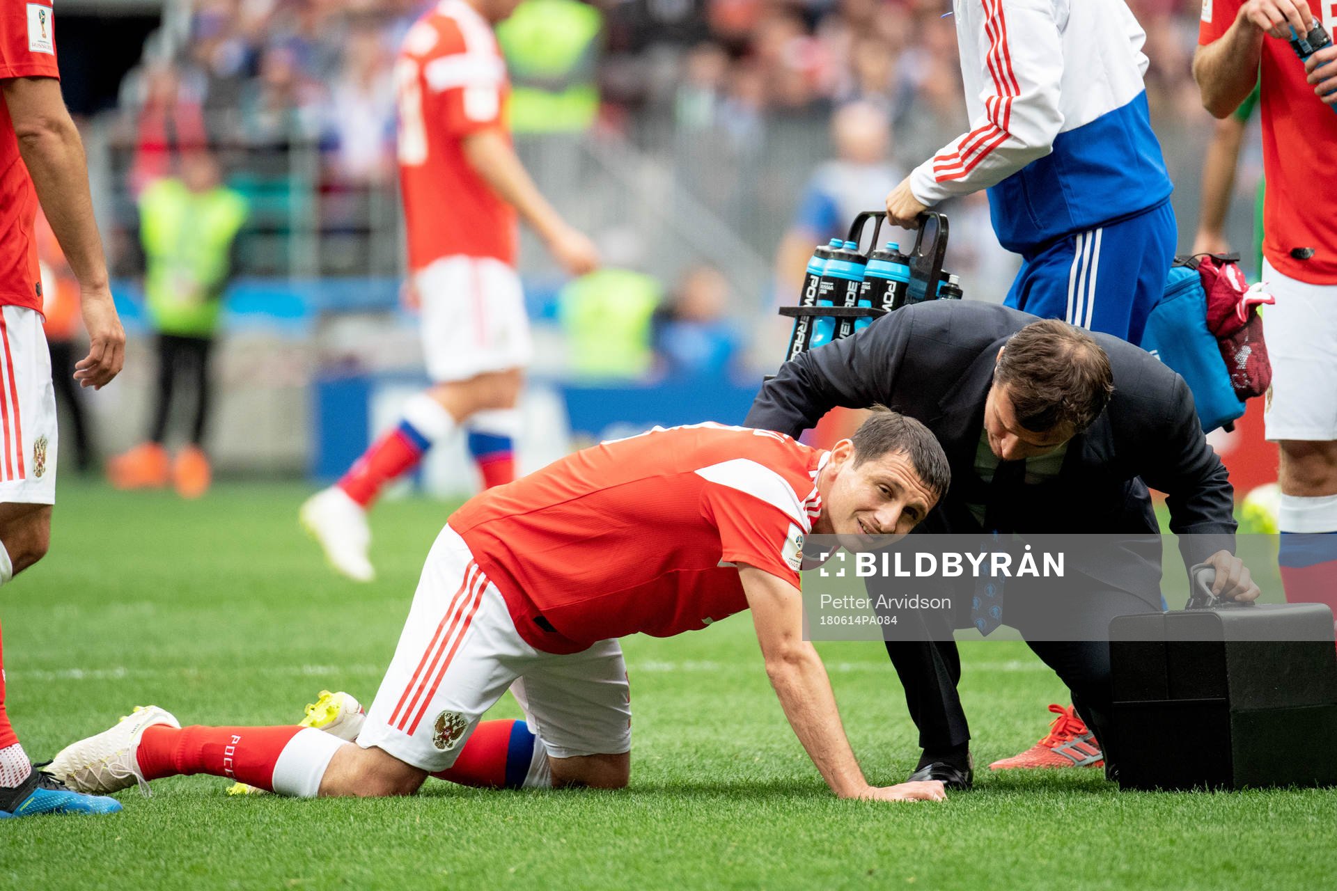 Alan Dzagoev of Russia lies injured during the FIFA World Cup group stage match between Russia and Saudi Arabia on June 14, 2018 in Moscow.