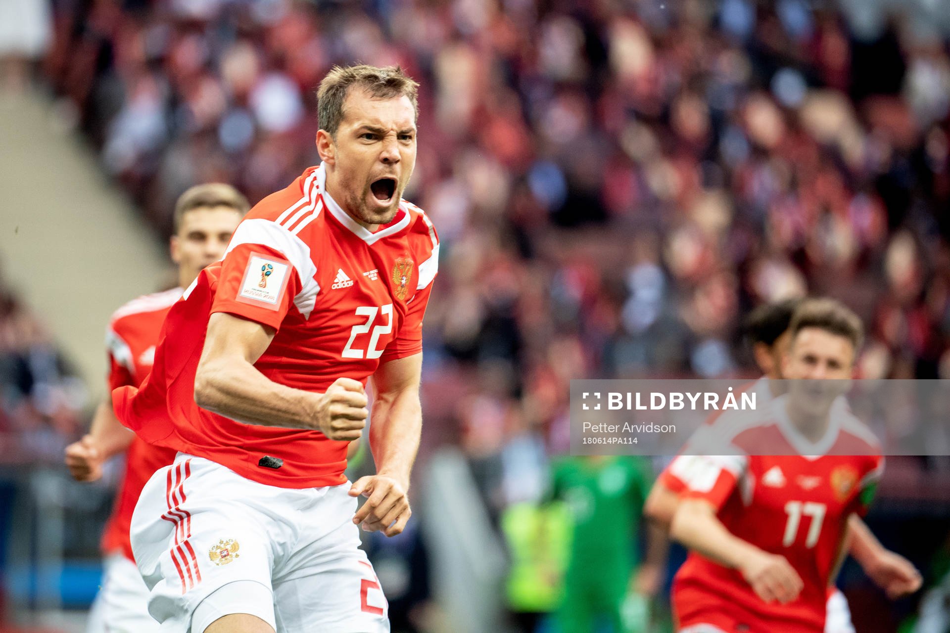 Artem Dzyuba of Russia celebrates after scoring 3-0 during the FIFA World Cup group stage match between Russia and Saudi Arabia on June 14, 2018 in Moscow.