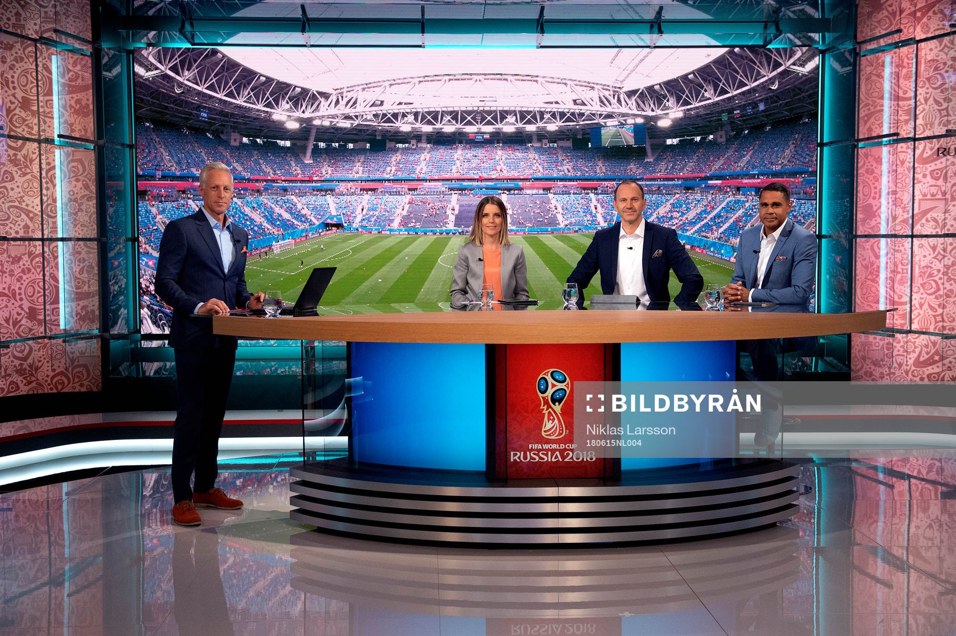 SVTs programledare André Pops, Johanna Frändén, Jonas Eriksson och Daniel Nannskog i studion under fotbolls-VM den 15 juni 2018 i Stockholm.