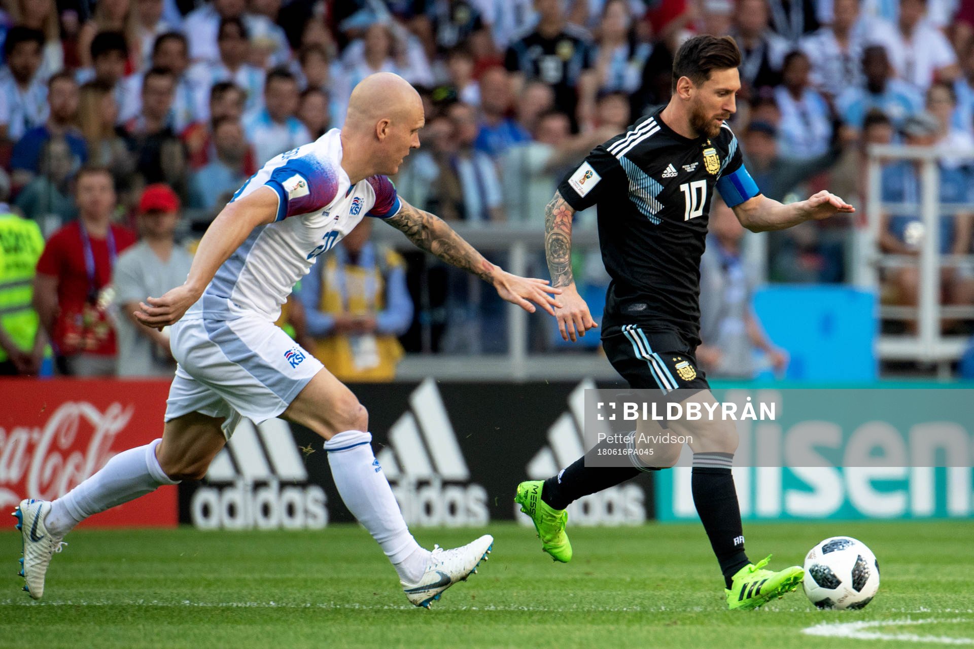 Emil Hallfredsson of Iceland and Lionel Messi of Argentina
