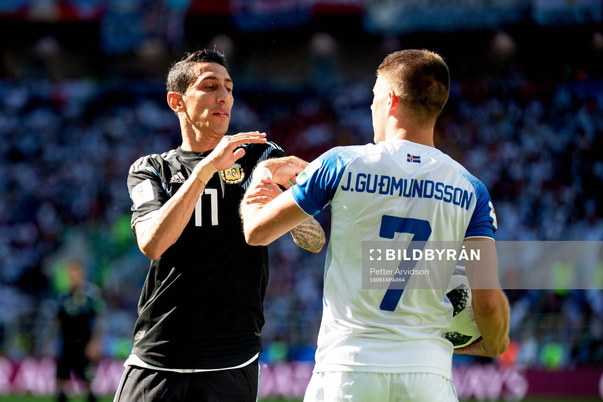 Angel Di Maria of Argentina and Johann Gudmundsson of