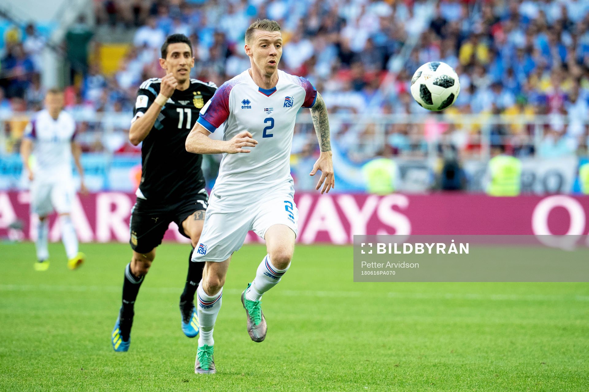 Angel Di Maria of Argentina and Birkir Saevarsson of Iceland