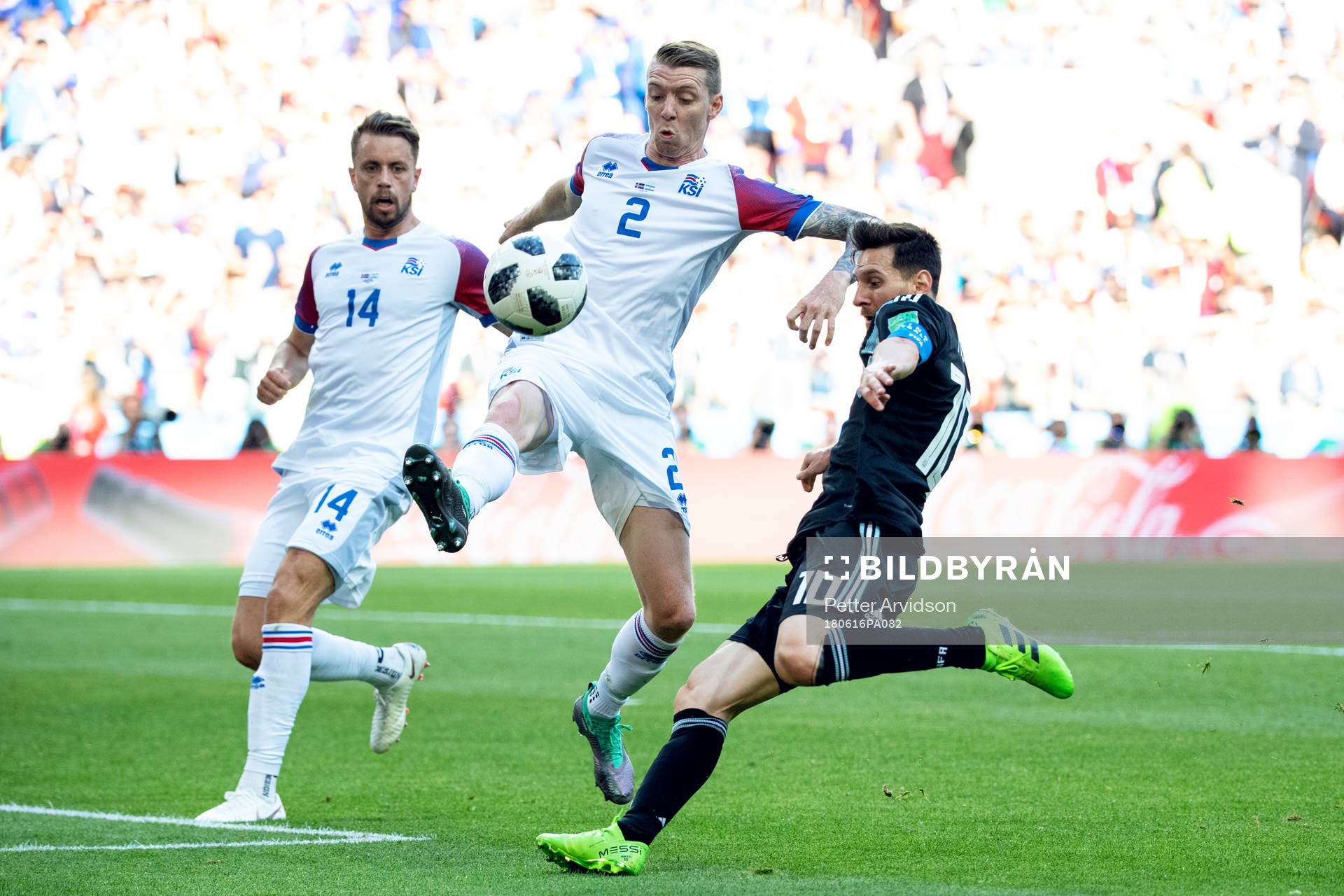 Birkir Saevarsson of Iceland and Lionel Messi of Argentina