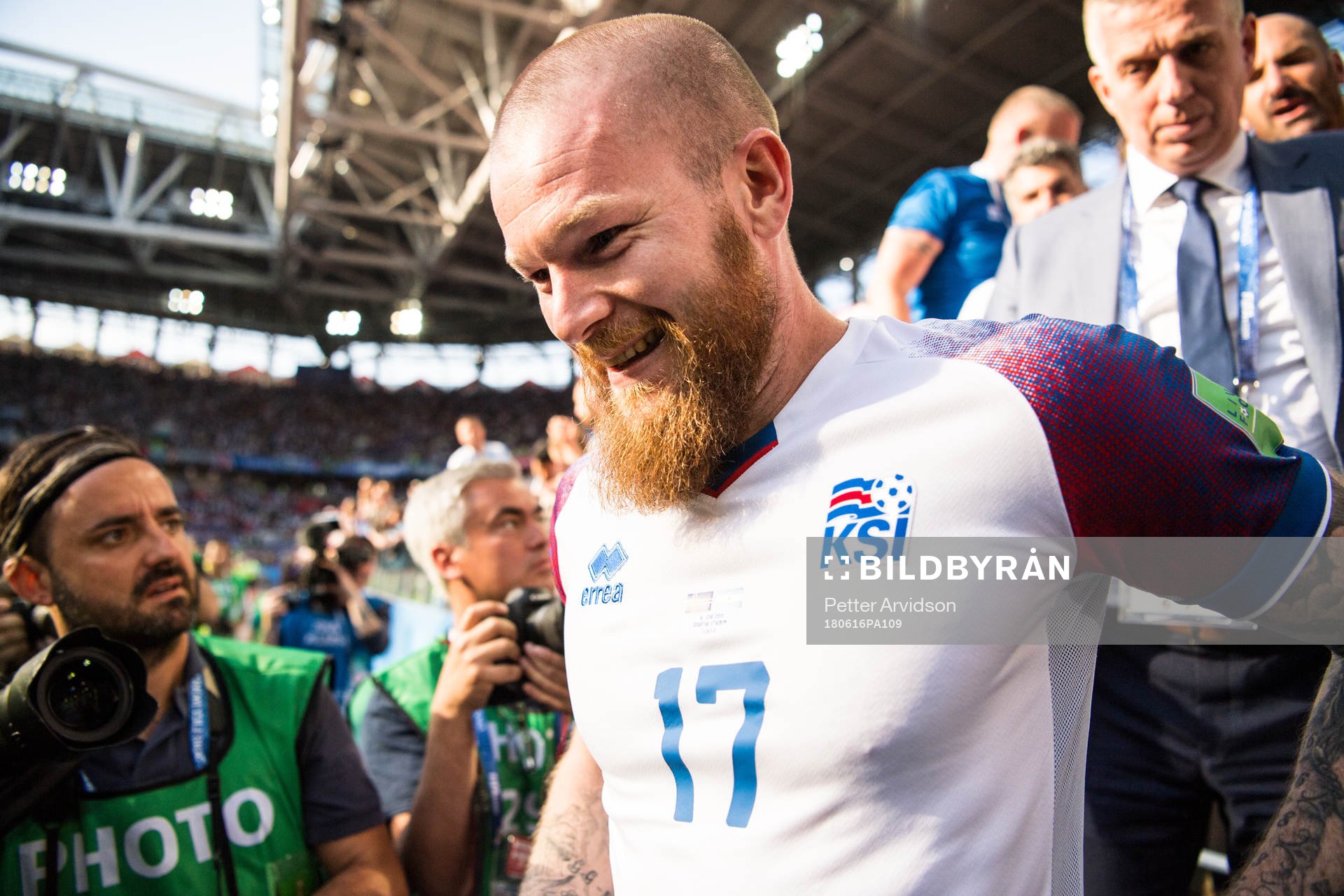 Aron Gunnarsson of Iceland celebrates with fans