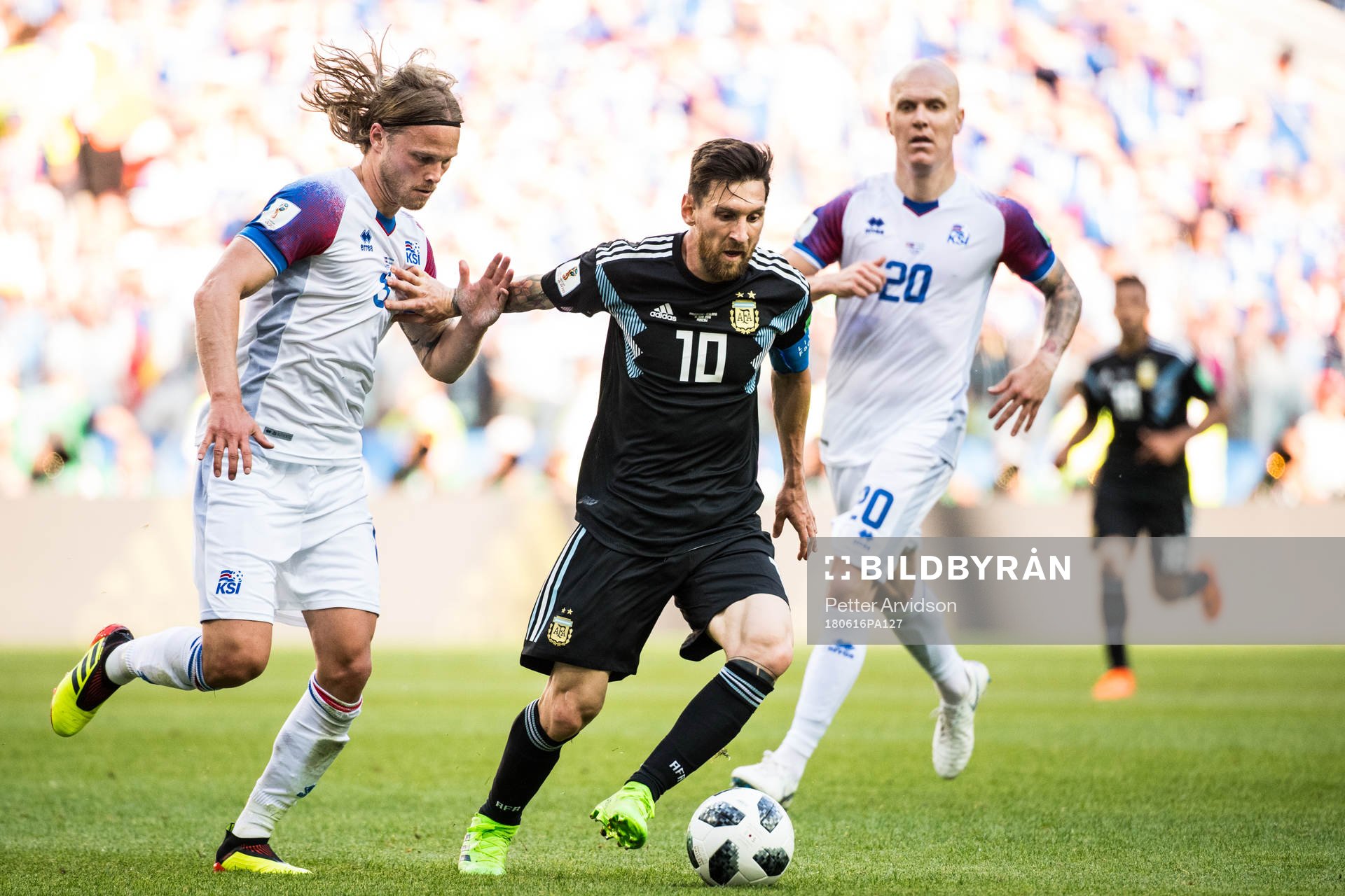 Lionel Messi of Argentina in action with of Iceland Birkir