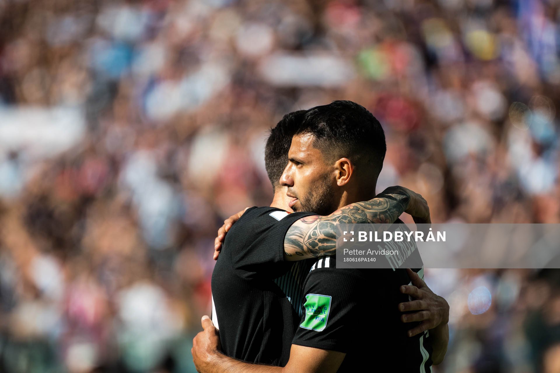 Lionel Messi celebrates with Sergio Aguero