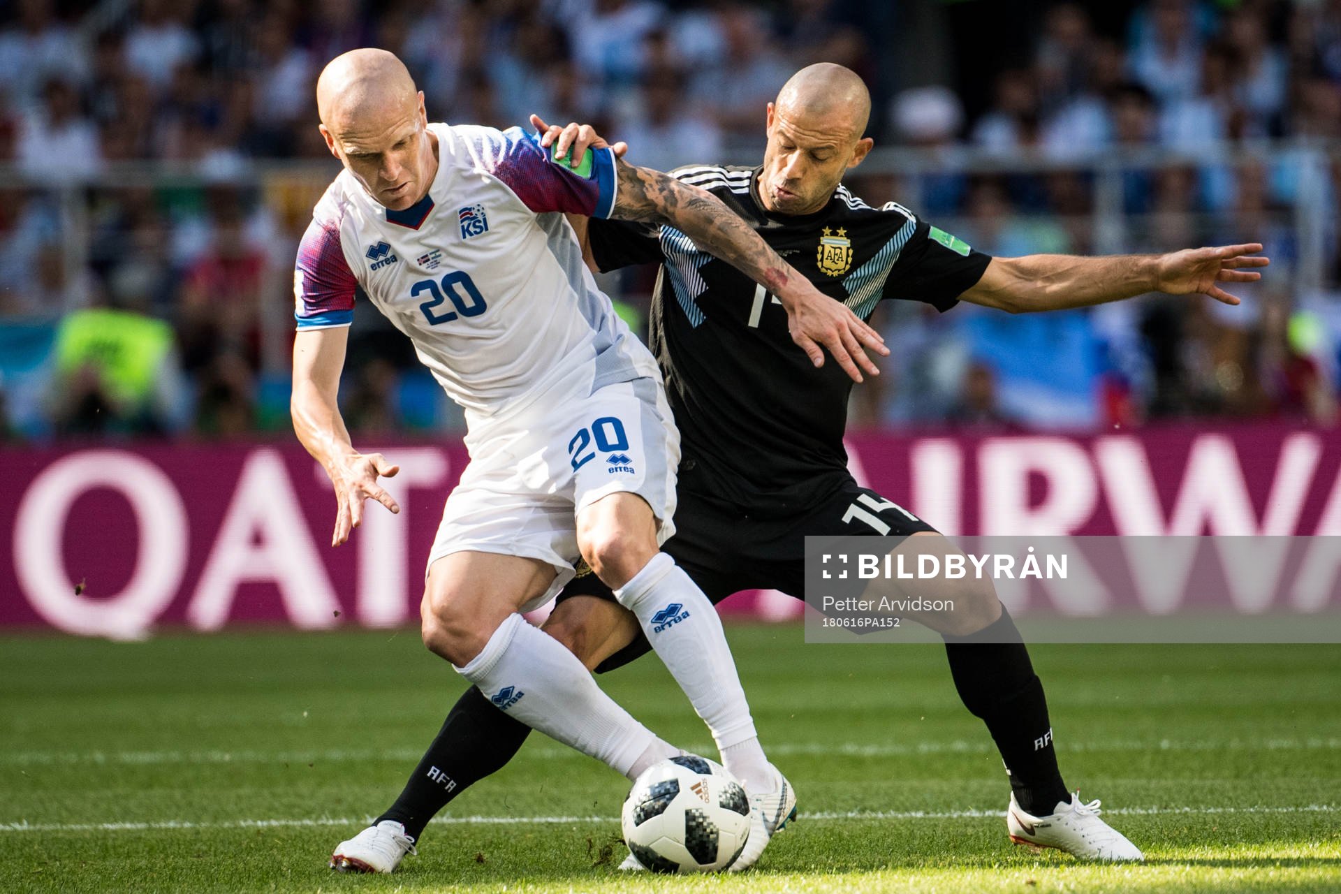 Emil Hallfredsson of Iceland in action with Javier