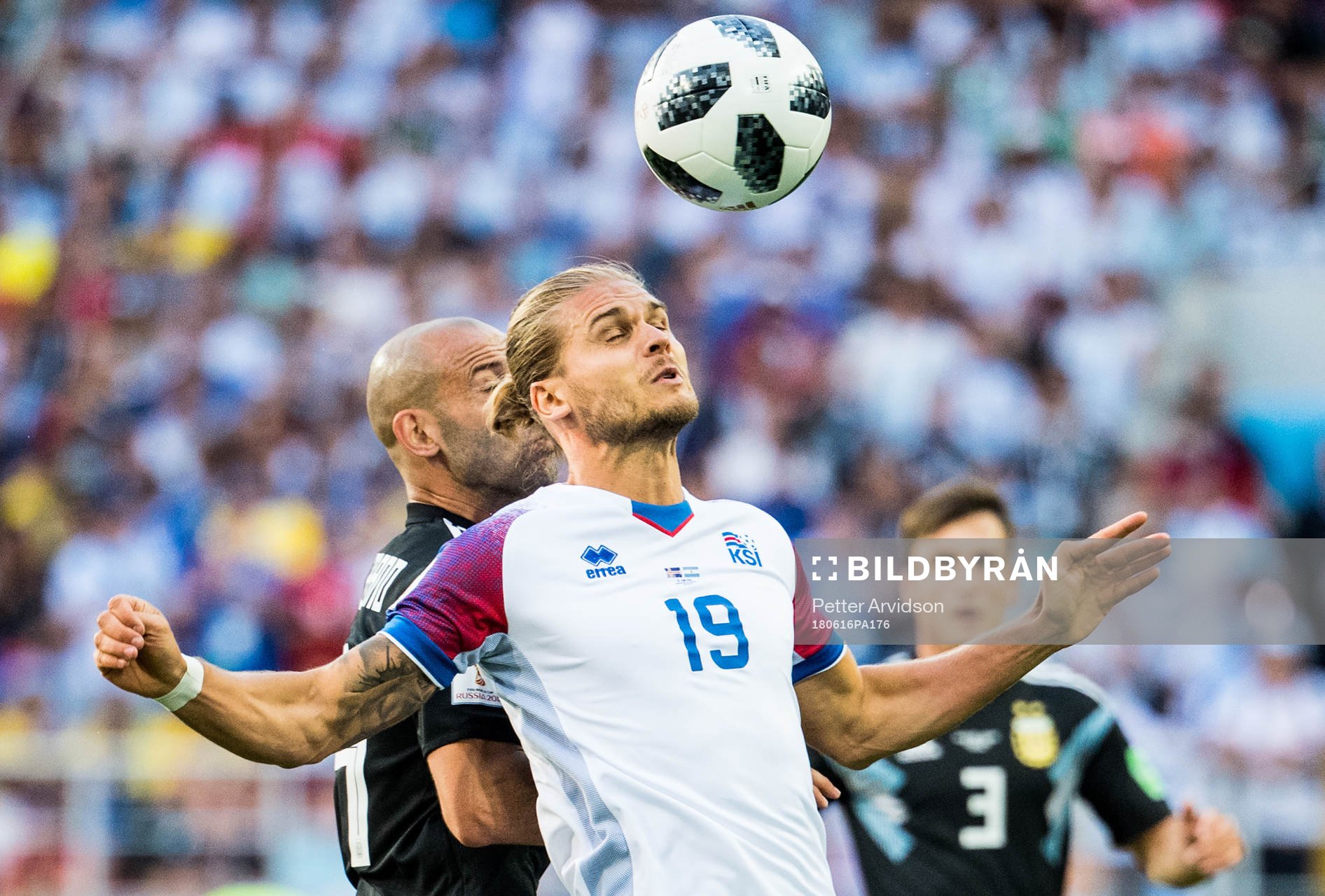 Rurik Gislason of Iceland and Javier Mascherano of Argentina