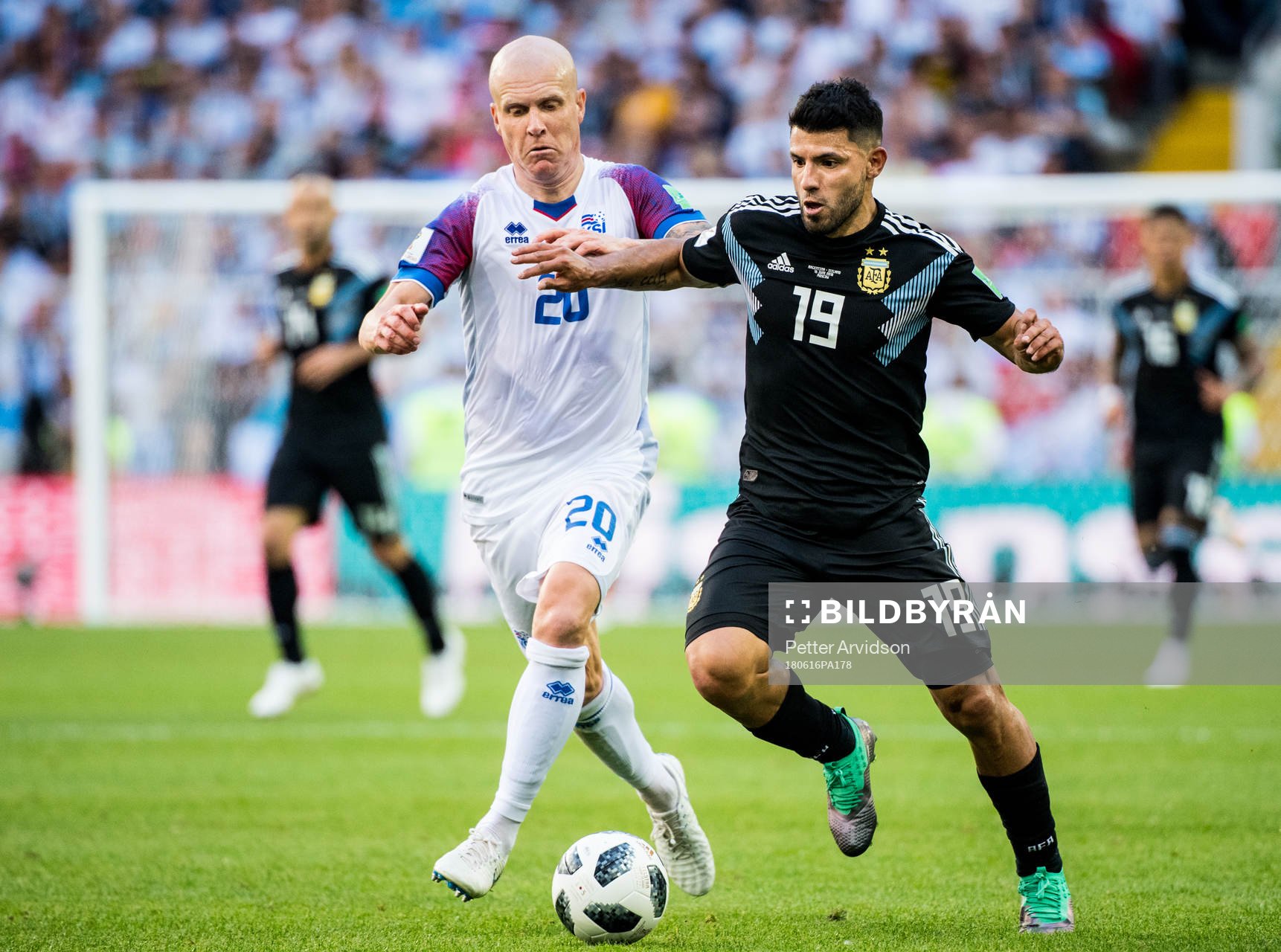 Emil Hallfredsson of Iceland and Sergio Aguero of Argentina