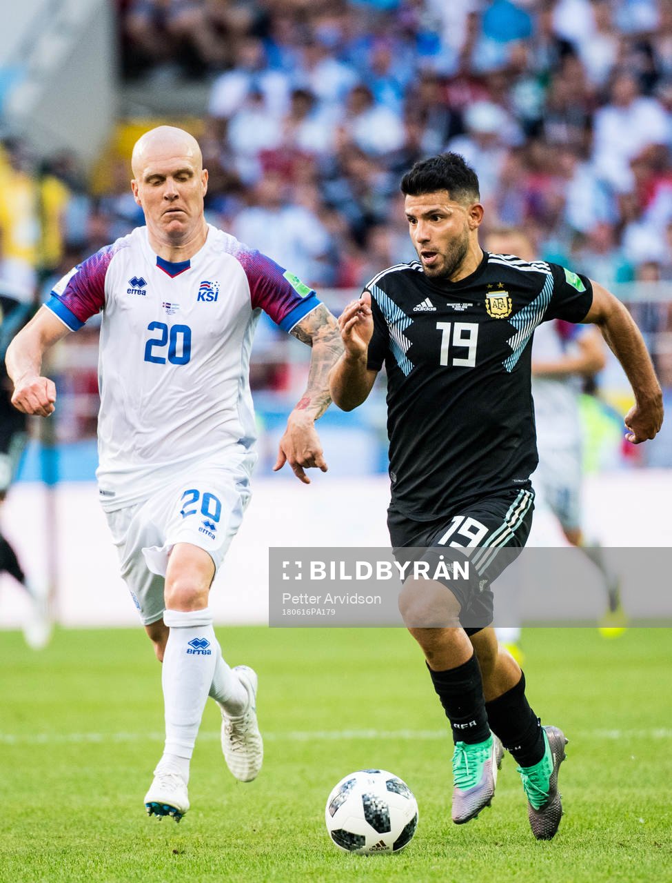 Emil Hallfredsson of Iceland and Sergio Aguero of Argentina