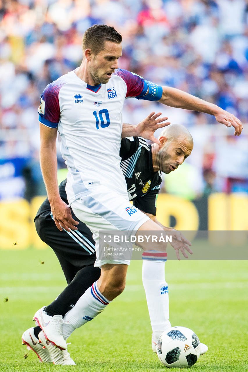 Gylfi Sigurdsson of Iceland and Javier Mascherano of