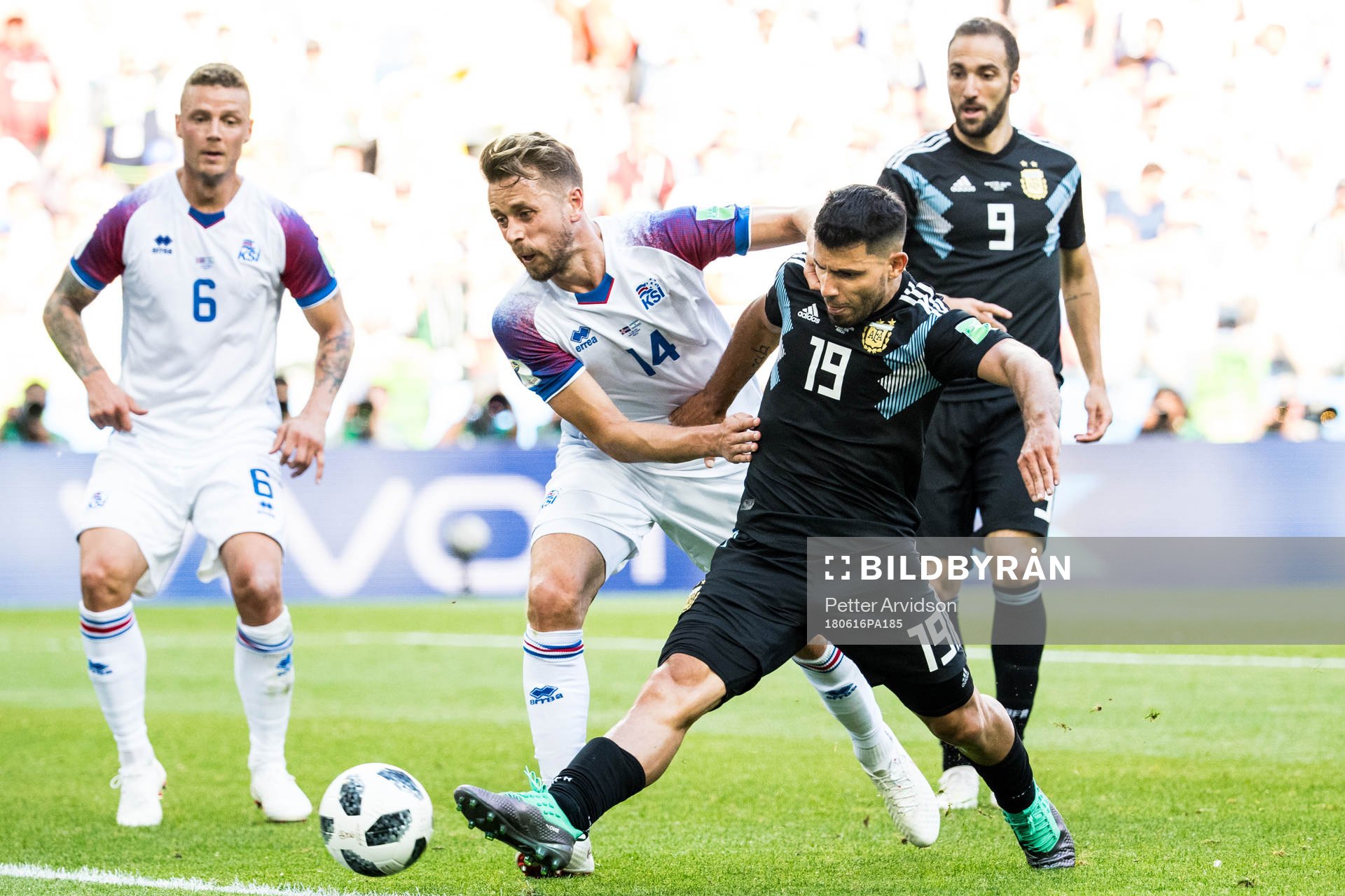 Sergio Aguero of Argentina and Kari Arnason of Iceland