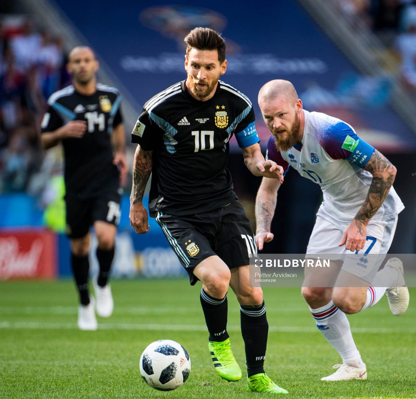 Lionel Messi of Argentina and Aron Gunnarsson of Iceland