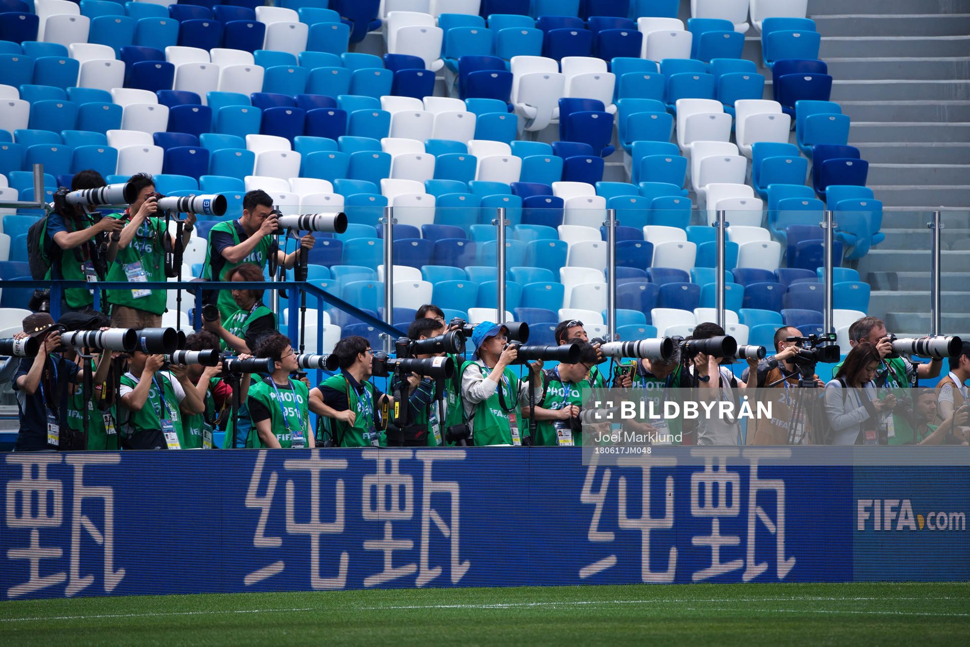 Photographers covering the Swedish national football team's
