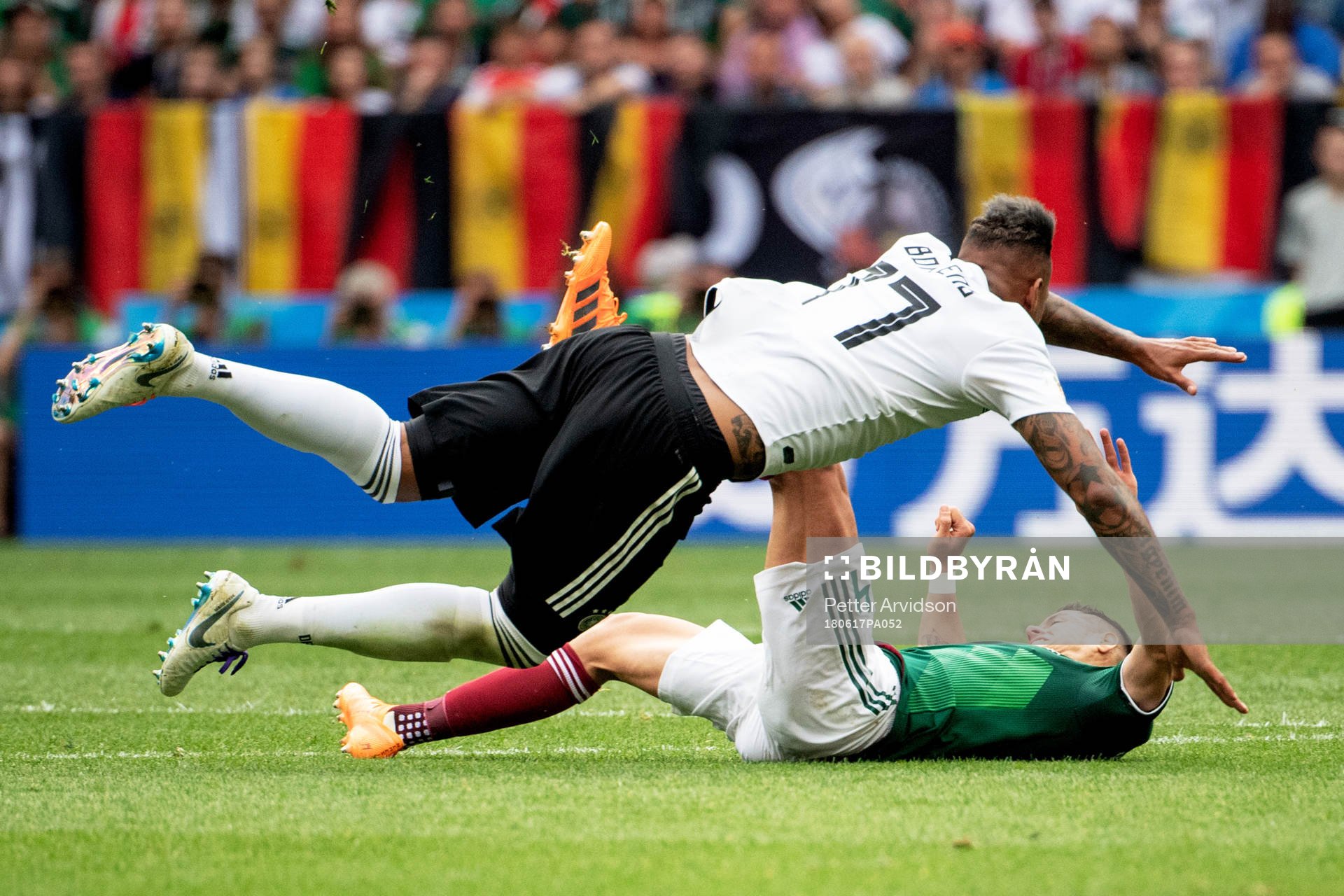 Jerome Boateng of Germany and Javier Hernandez of Mexico