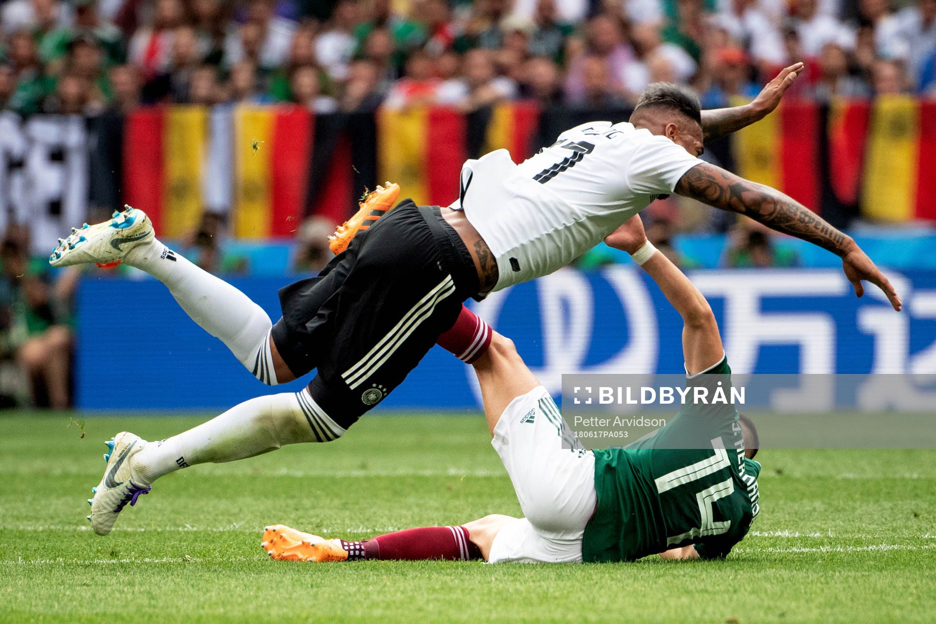Jerome Boateng of Germany and Javier Hernandez of Mexico