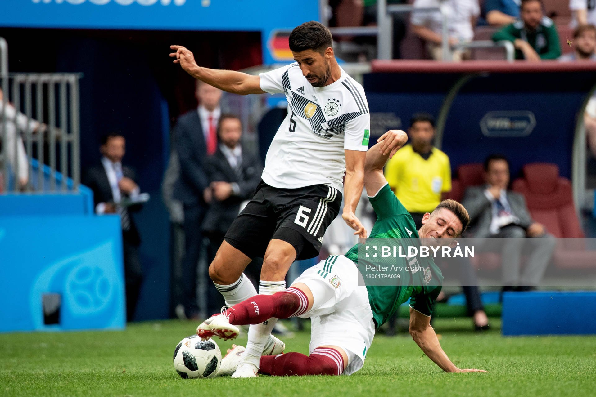 Sami Khedira of Germany and Hector Herrera of Mexico