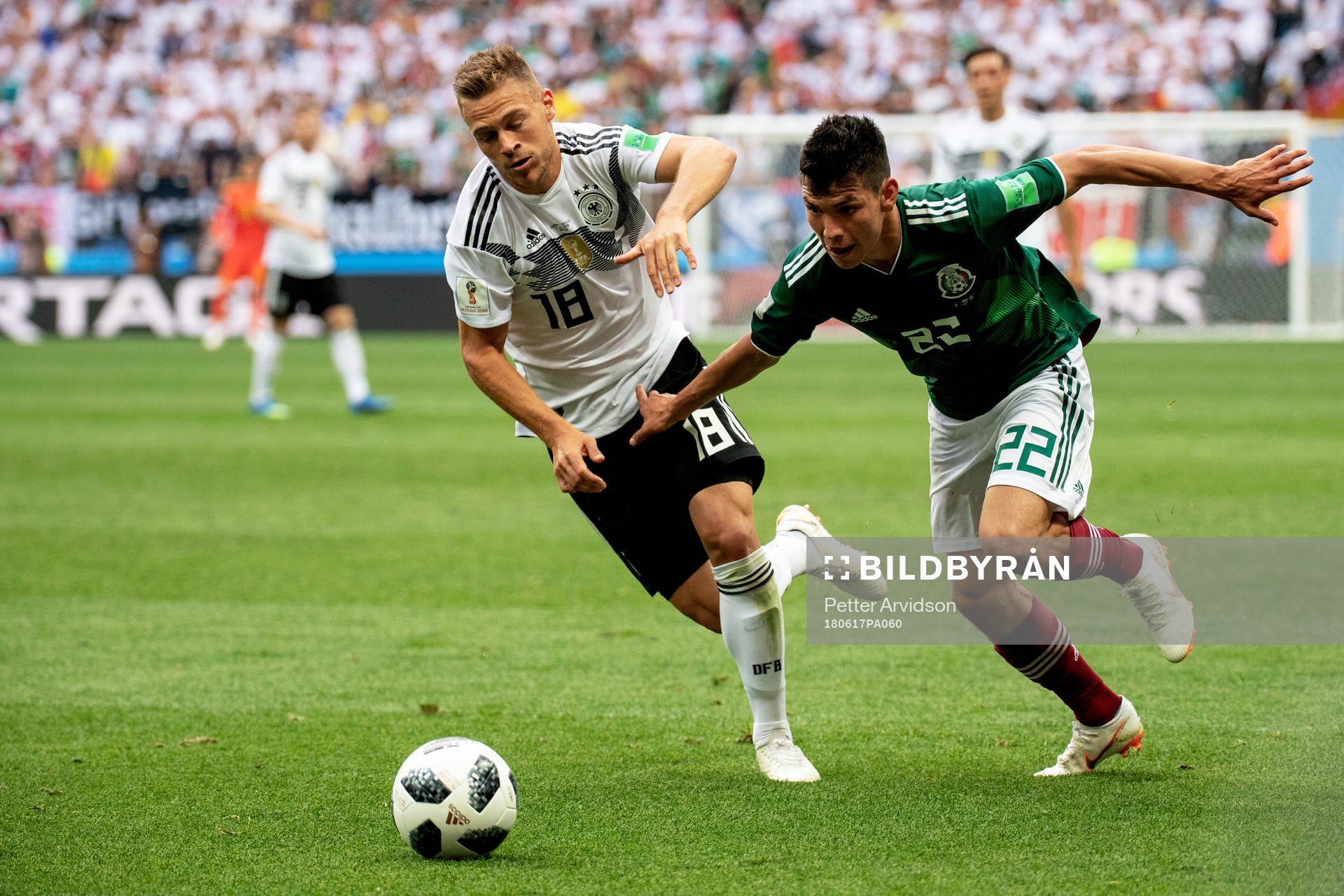 Joshua Kimmich of Germany and Hirving Lozano of Mexico