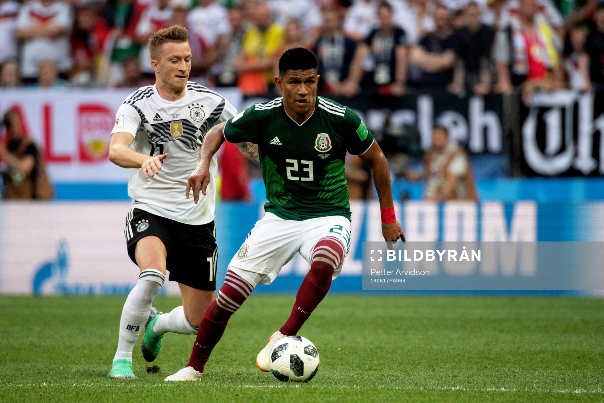 Marco Reus of Germany and Jesus Gallardo of Mexico