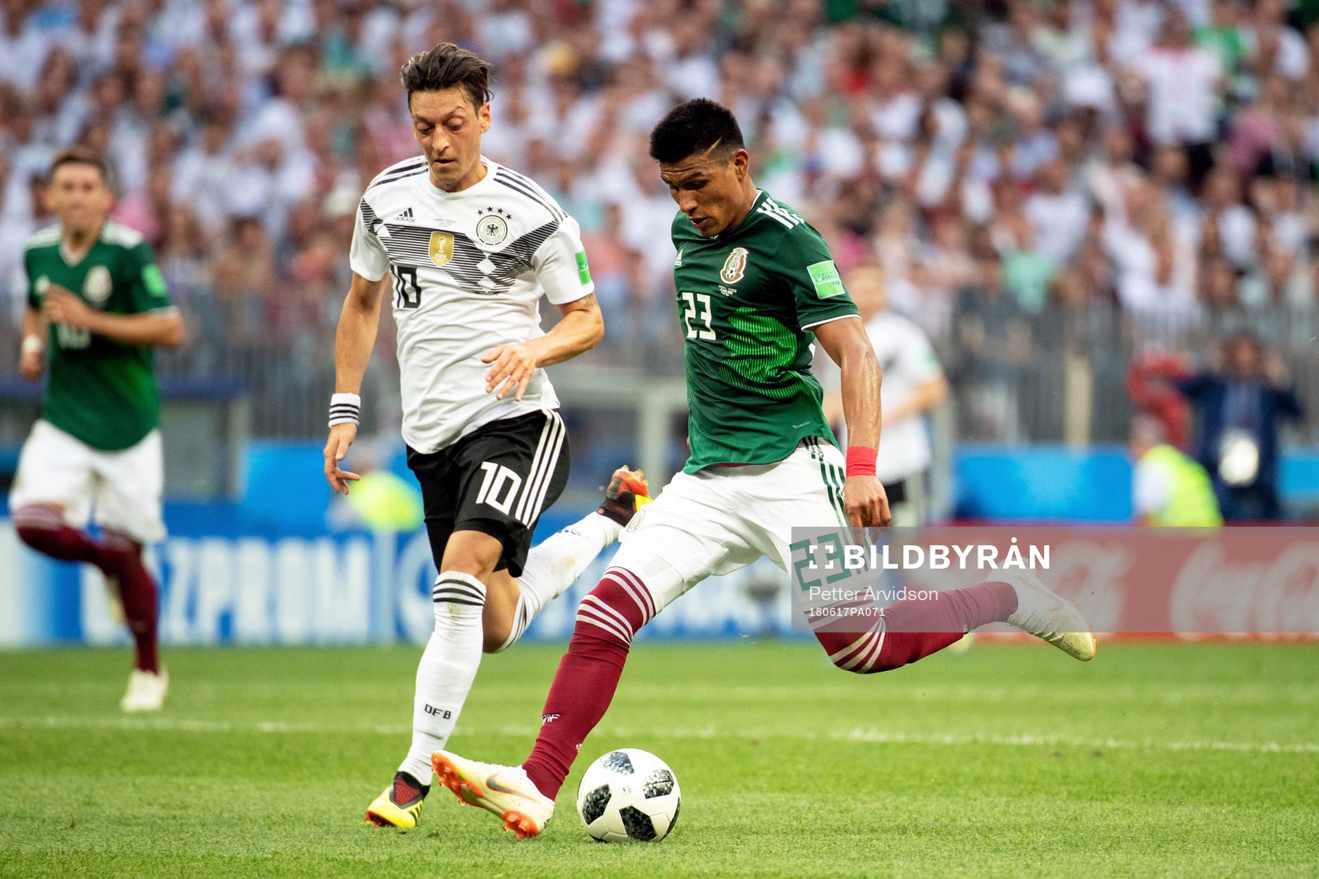 Mesut Özil of Germany and Jesus Gallardo of Mexico