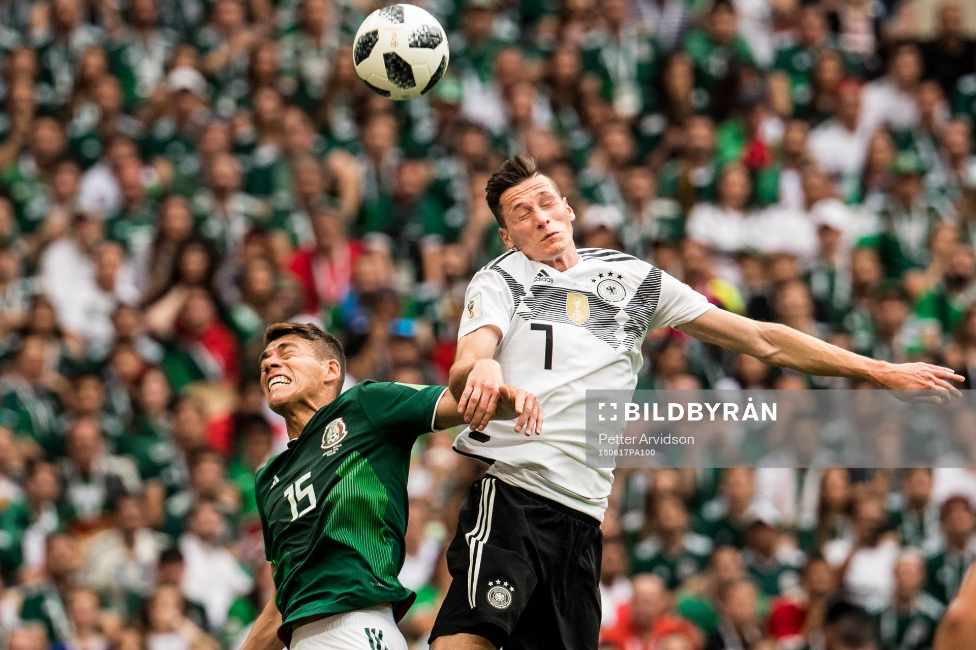 Hector Moreno of Mexico and Julian Draxler of Germany