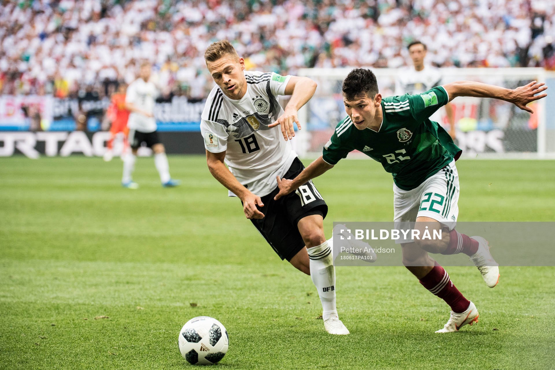 Joshua Kimmich of Germany and Hirving Lozano of Mexico during the FIFA World Cup group stage match between Germany and Mexico on June 17, 2018 in Moscow.