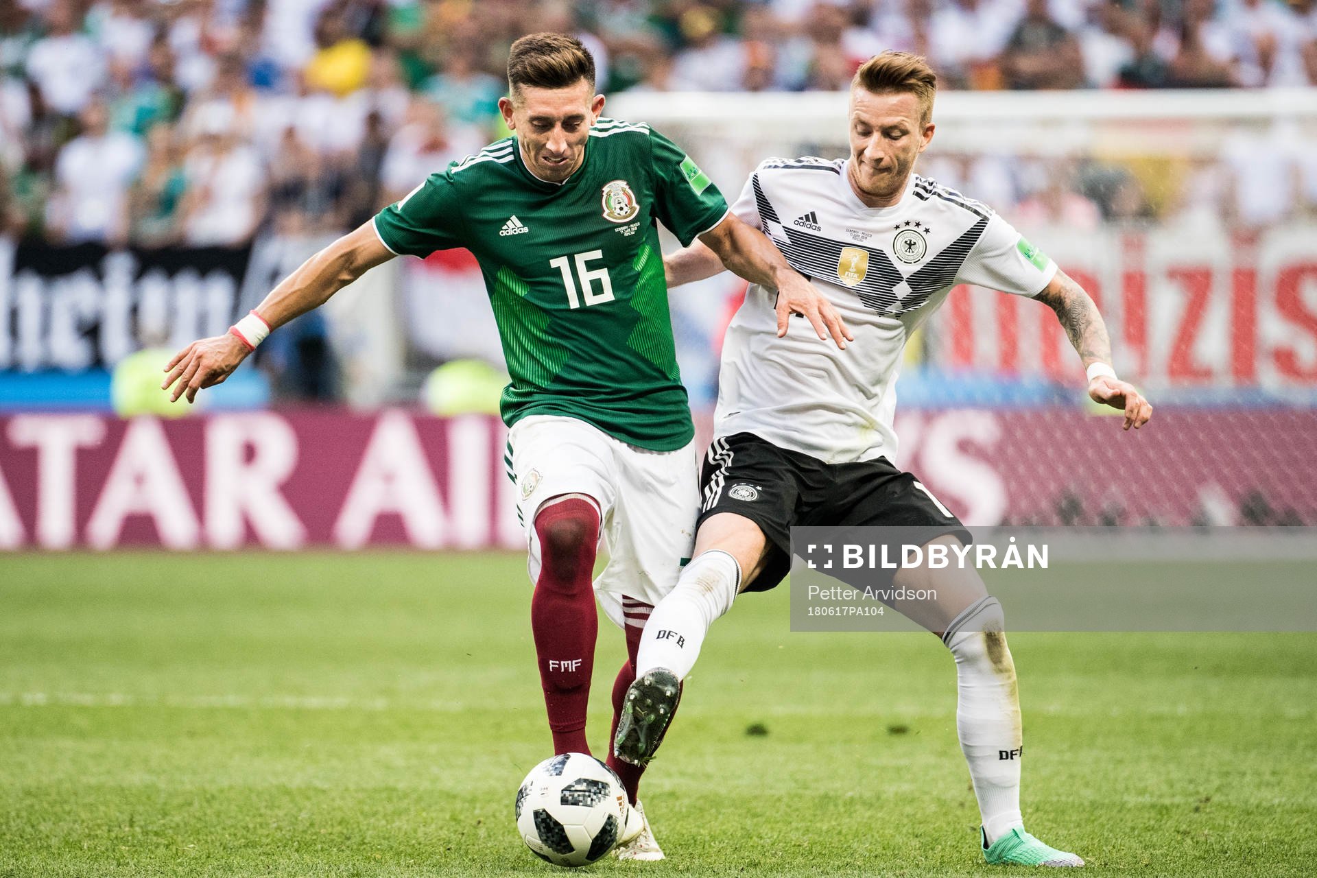 Hector Herrera of Mexico in action with Marco Reus of