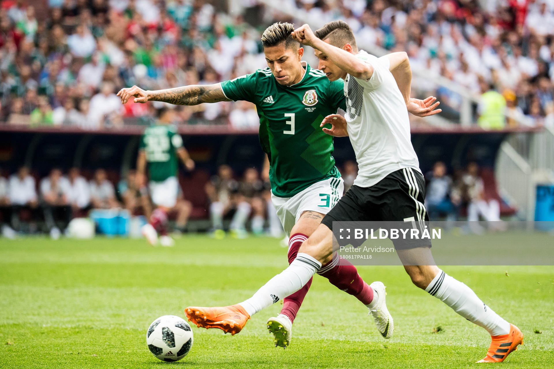 Carlos Salcedo of Mexico in action with Julian Draxler of