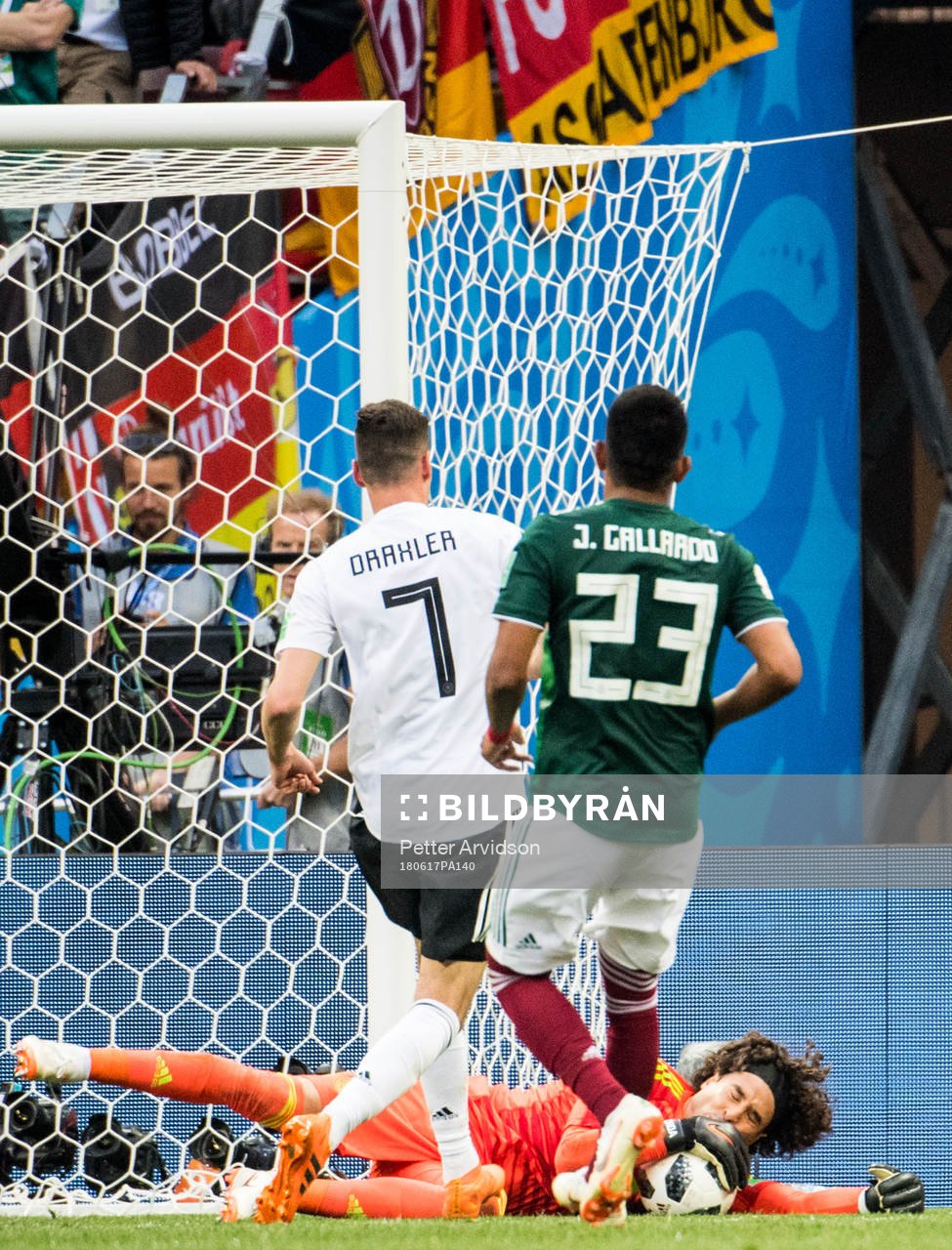 Goalkeeper Guillermo Ochoa of Mexico saves from Julian